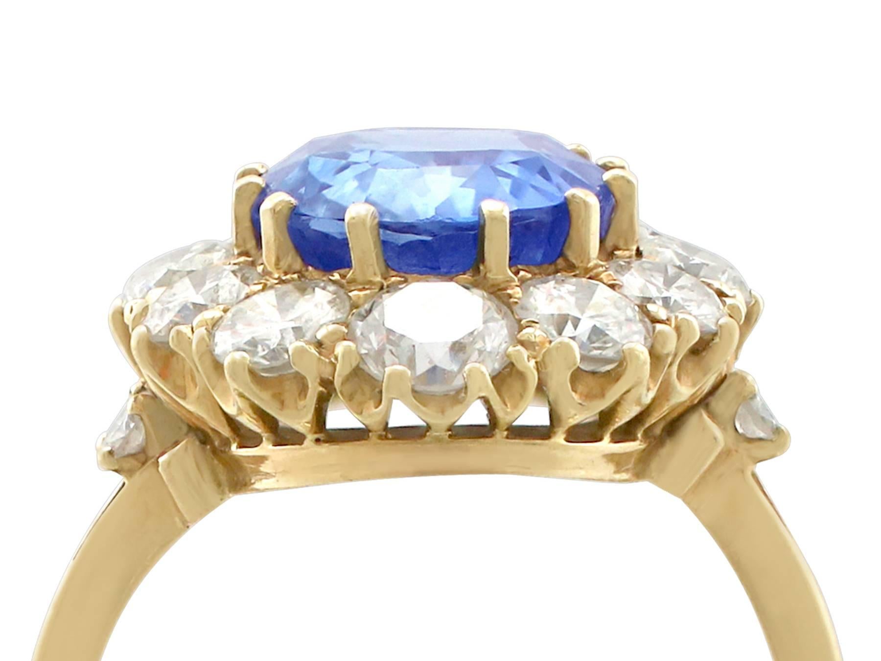 A stunning vintage 4.10 carat Ceylon sapphire and 1.75 carat diamond, 18k yellow gold cluster style dress ring; part of our diverse sapphire jewellery collections.

This stunning, fine and impressive Ceylon* sapphire ring with diamonds has been