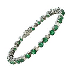 1980s 5.90 Carat Emerald Diamond Silver Tennis Bracelet