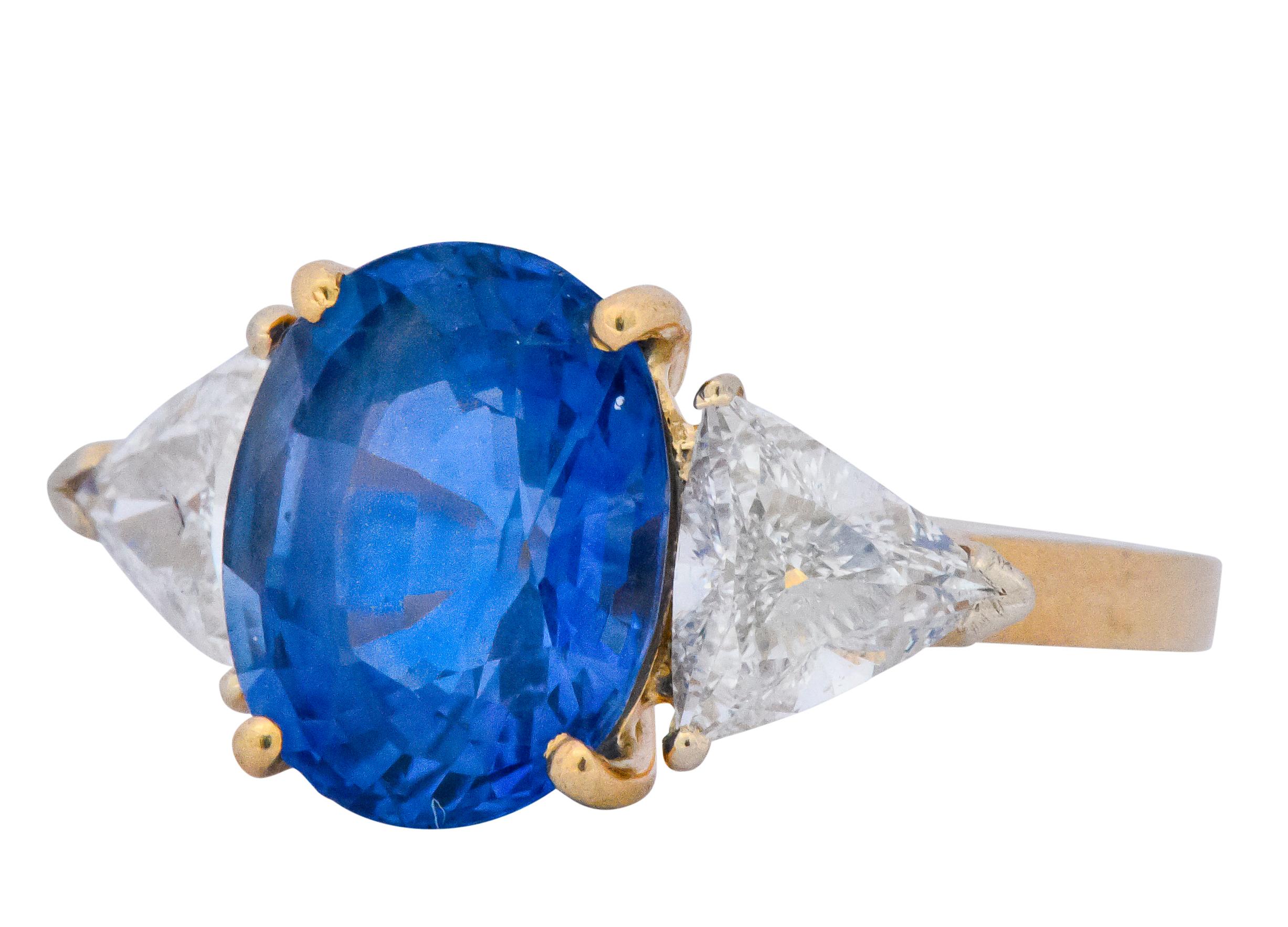 Centering an oval cut Ceylon sapphire (Sri Lanka), weighing approximately 5.50 carats

Flanked by trillion cut diamonds weighing approximately 1.30 carats total, G color and VS2 to SI1 clarity

6.80 CTW

Prong set in cathedral style mount

Stamped