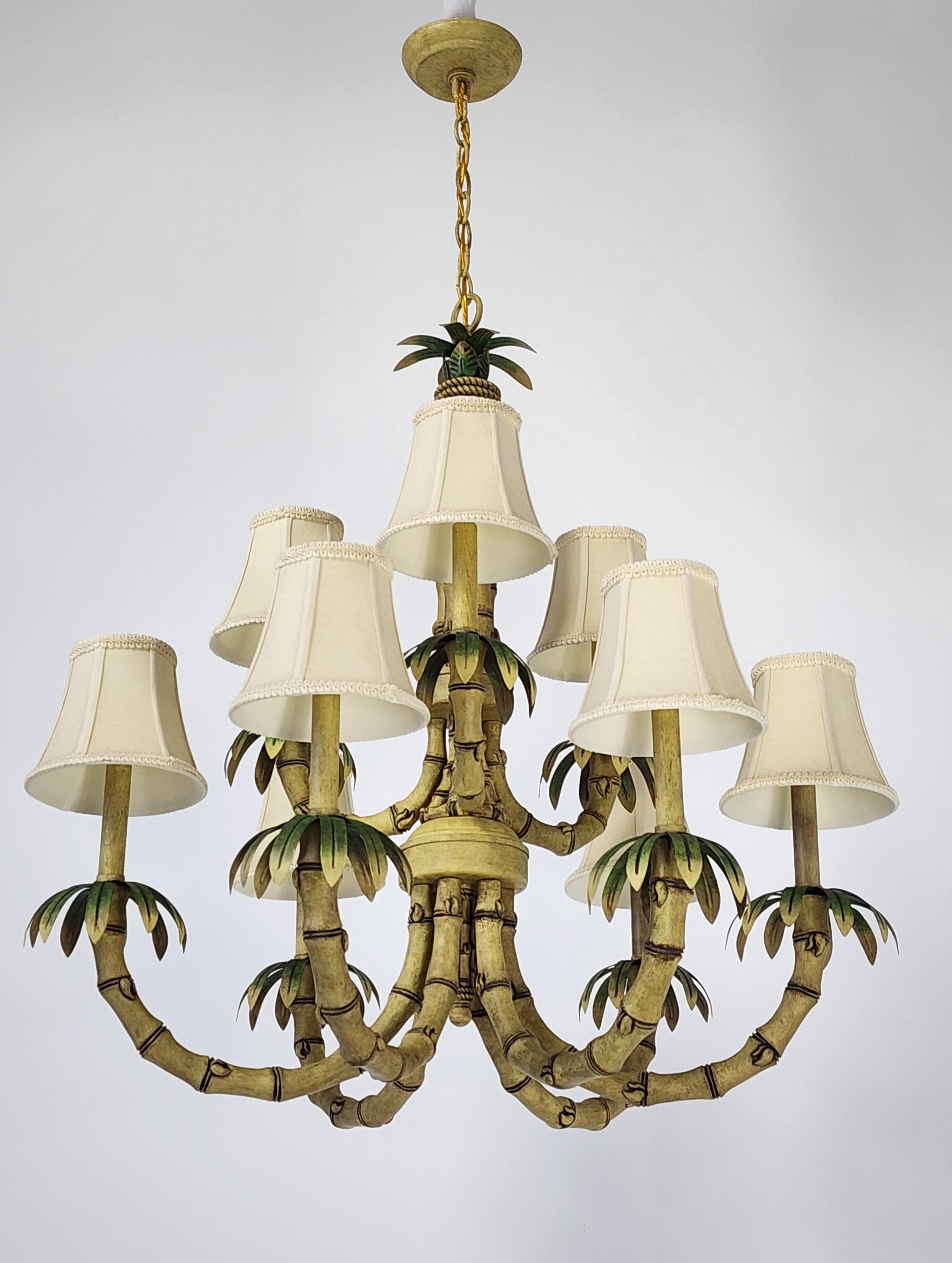 Extremely well made faux bamboo chandelier with tole palm leafs . 

Solid sturdy construction. 

Contain 9 candelabra sockets rated at 40 watt each. 

Pictured shade  come with order  . 

Chain lenght is 10 in.   for a total drop of 43 in.  Could be