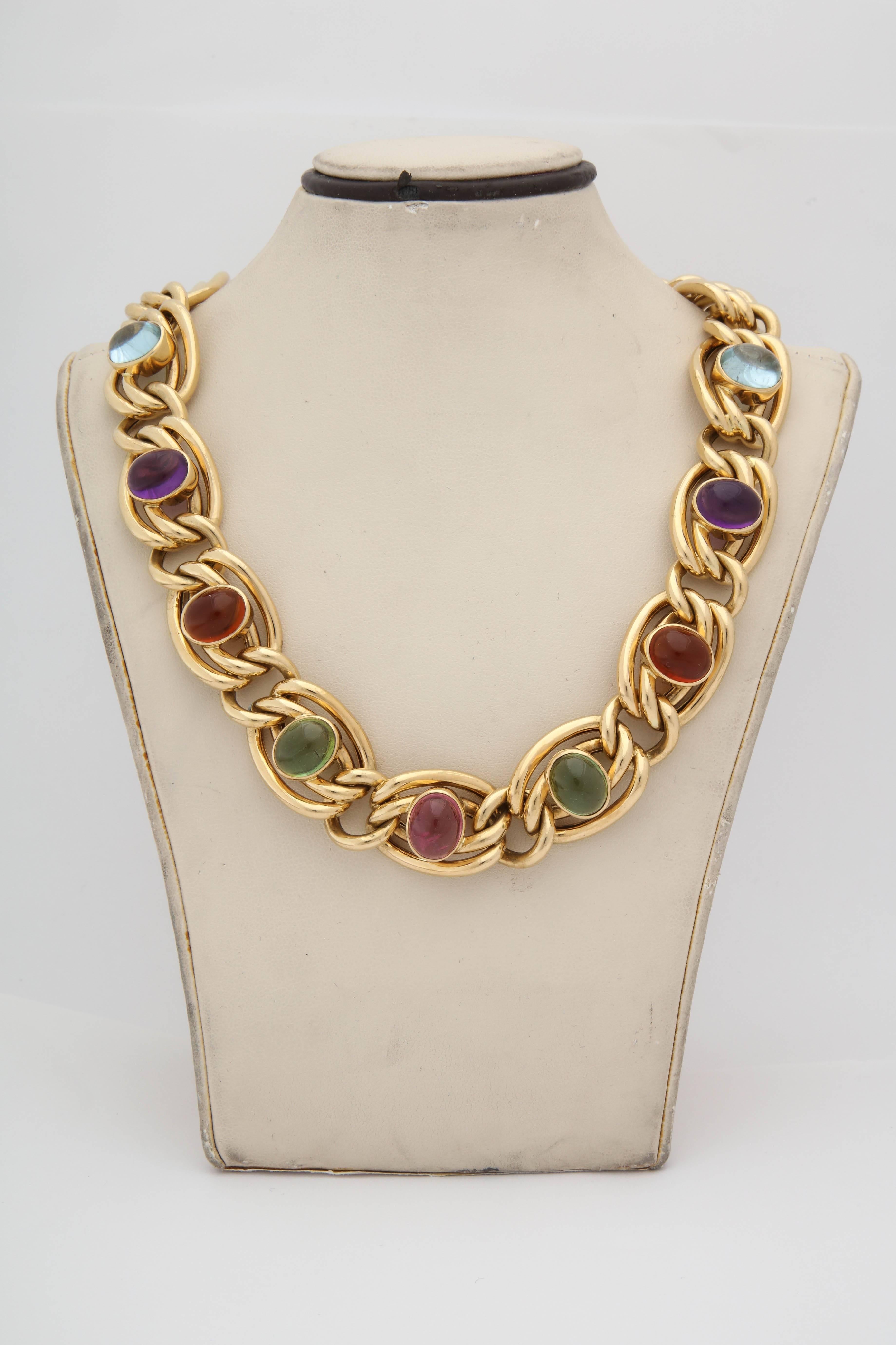 One Ladies 18kt Yellow Gold Double Open Link Necklace Designed With Nine Oval Cabochon Multicolored Stones:Two Aquamarines,Two Amethysts,Two Citrines Two Peridots And One Pink Tourmaline; All Measuring Approximately {5} Carats Each Stone. Total