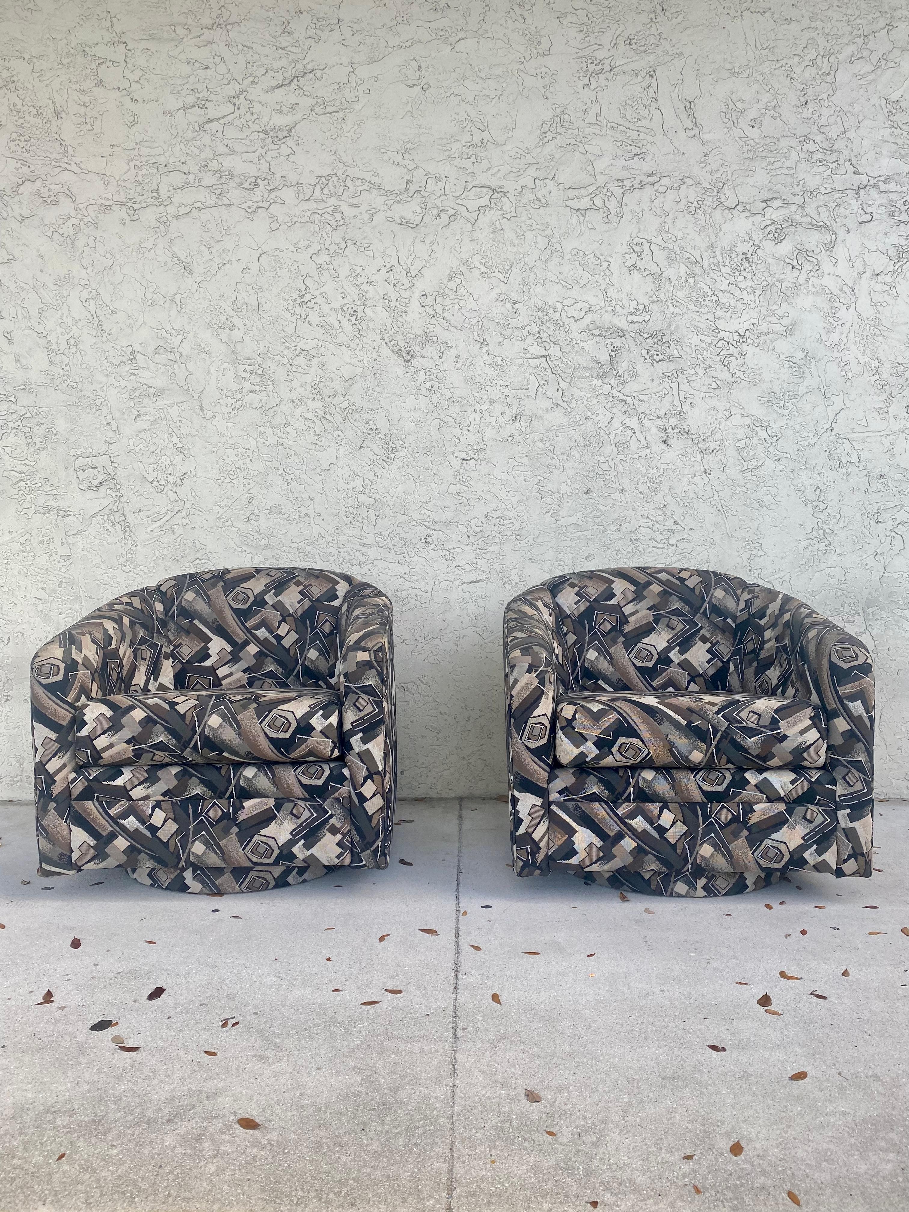 These Iconic stylish original upholstered swivel chairs are packed with personality! Outstanding design is exhibited throughout the monumental form. Post modern Memphis Style Swivel Chairs are beyond cool. Their beautiful and unique shape are