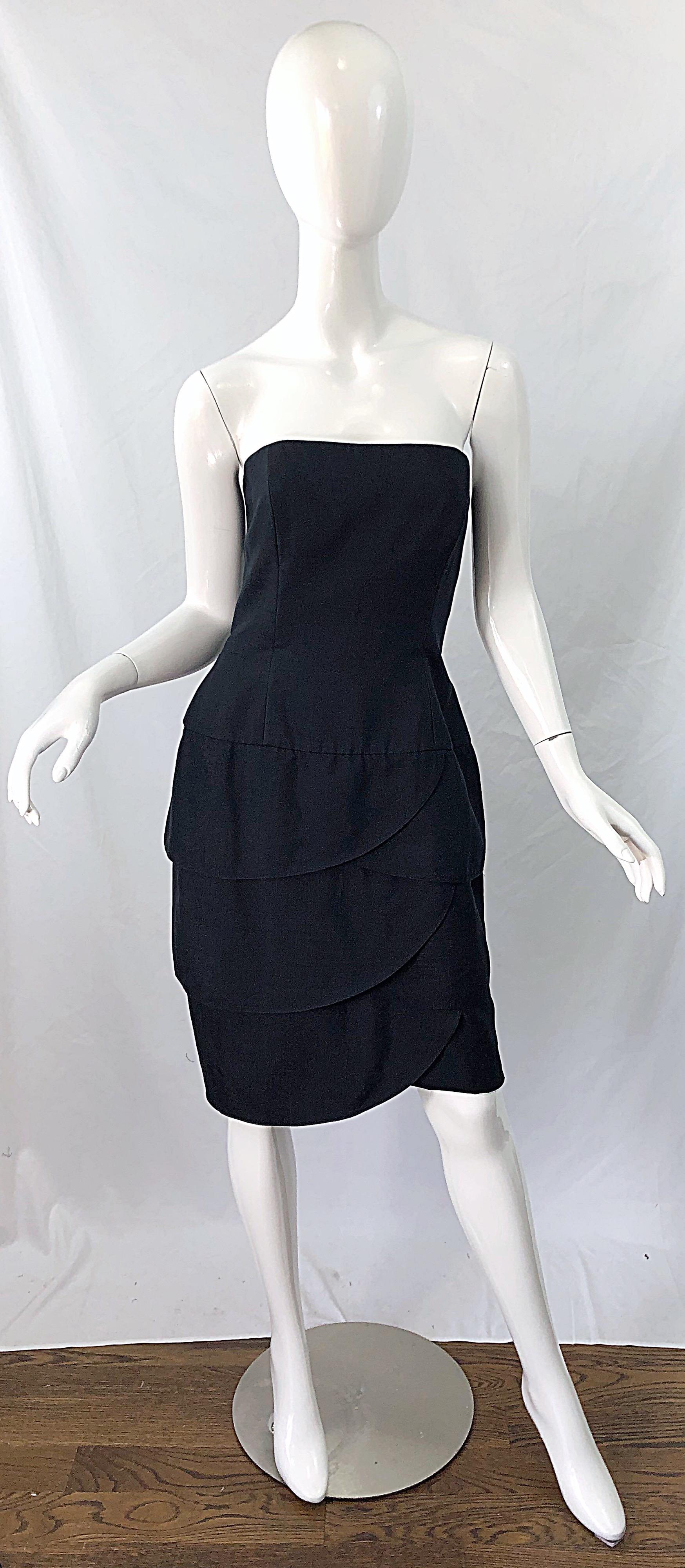 The perfect little black dress ! This chic silk number was designed by AJ BARI for LORD AND TAYLOR ! Strapless boned bodice. Tulip car wash skirt. Hidden zipper up the back with hook-and-eye closure. Very well made, with lots of attention to