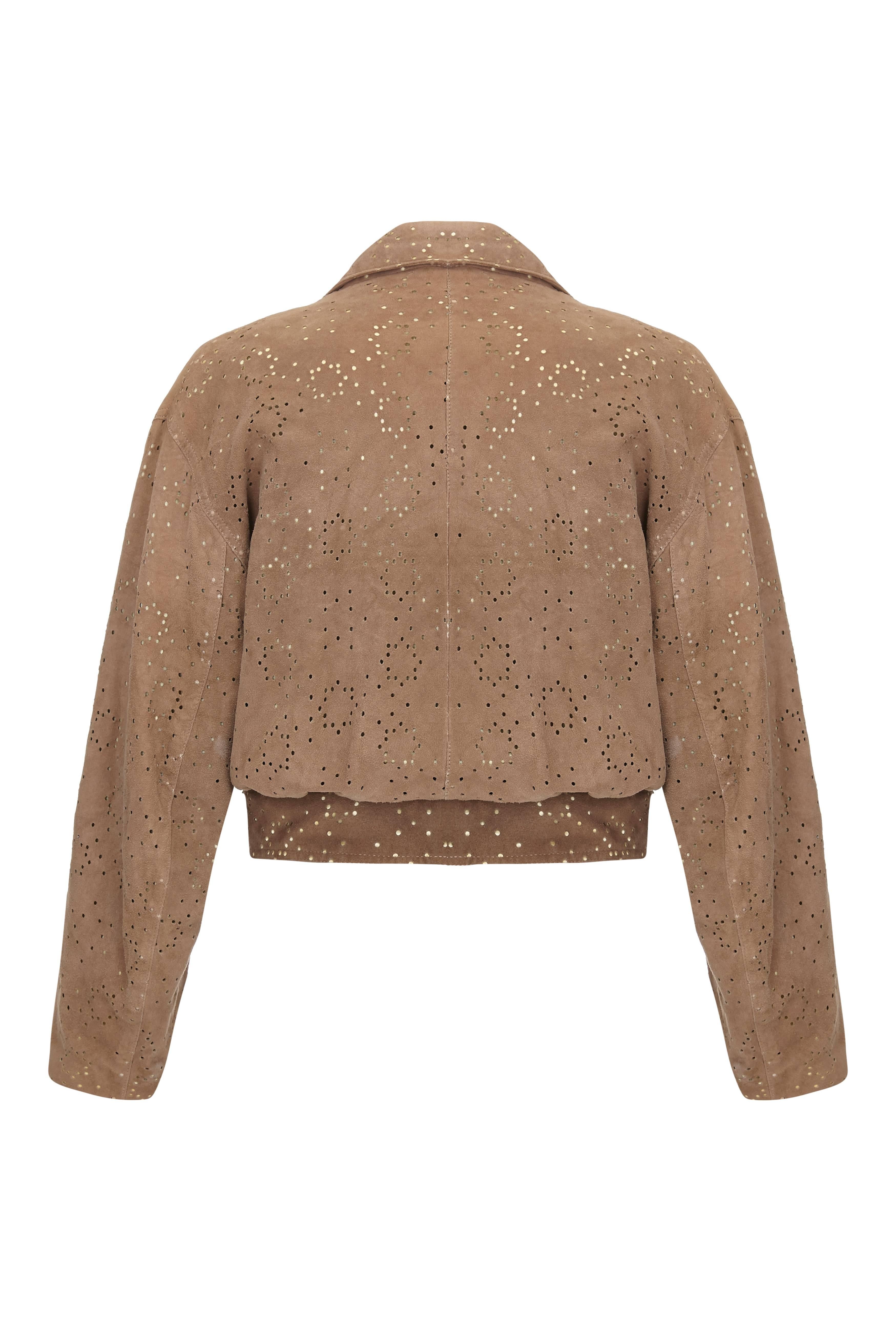 This desirable tawny lamb skin jacket with laser cut detail is by French designer Alaïa and is in superb vintage condition. A documented runway piece from his spring / summer 1989 collection, Alaïa established his ready to wear label in 1980 having