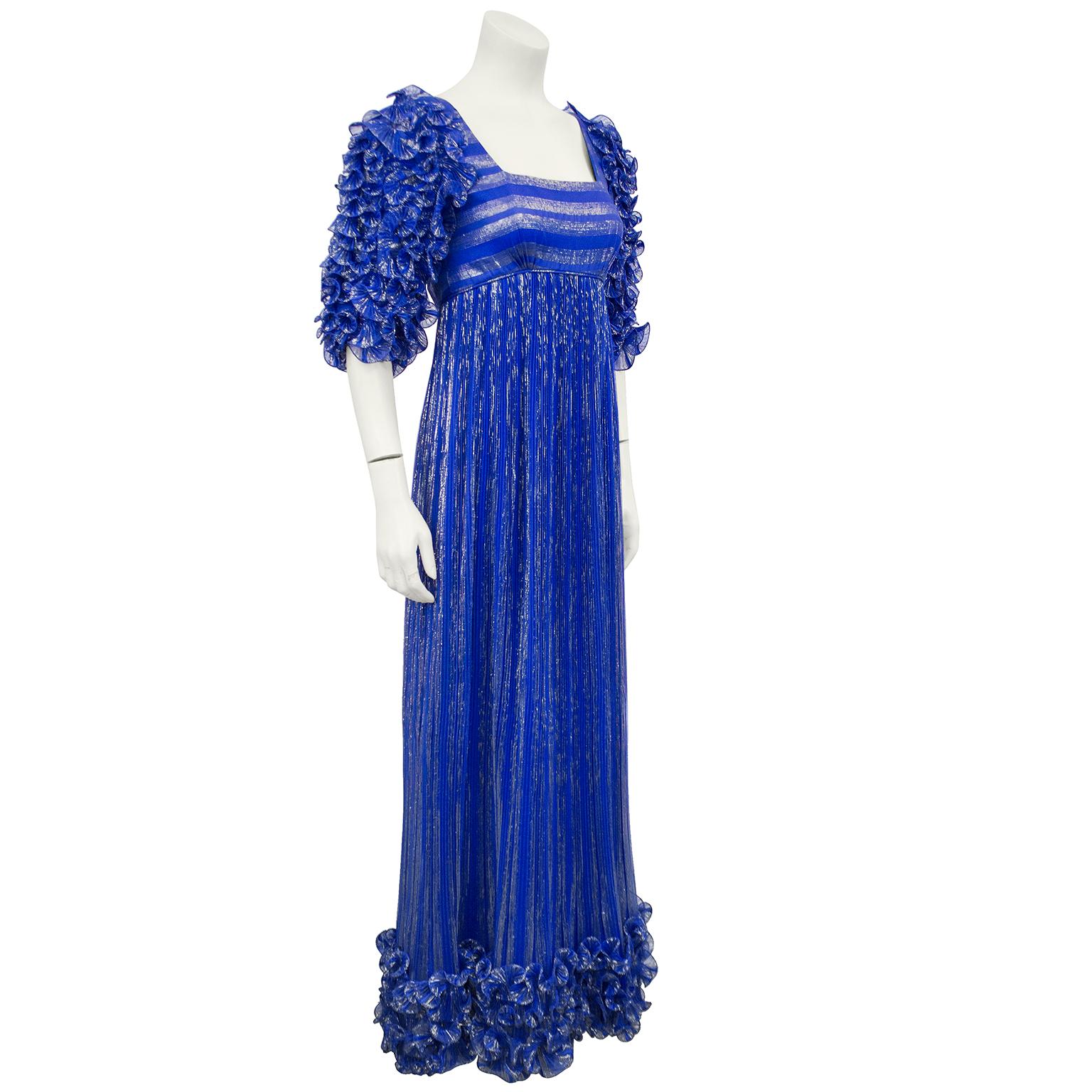 Dynasty era late 70's early 80's 's Alfred Bosand empress Josephine style gown. Plisé pleated origami style short sleeves with matching detail above the hemline. Square low cut neckline, column style skirt. Fully lined in royal blue. The royal blue