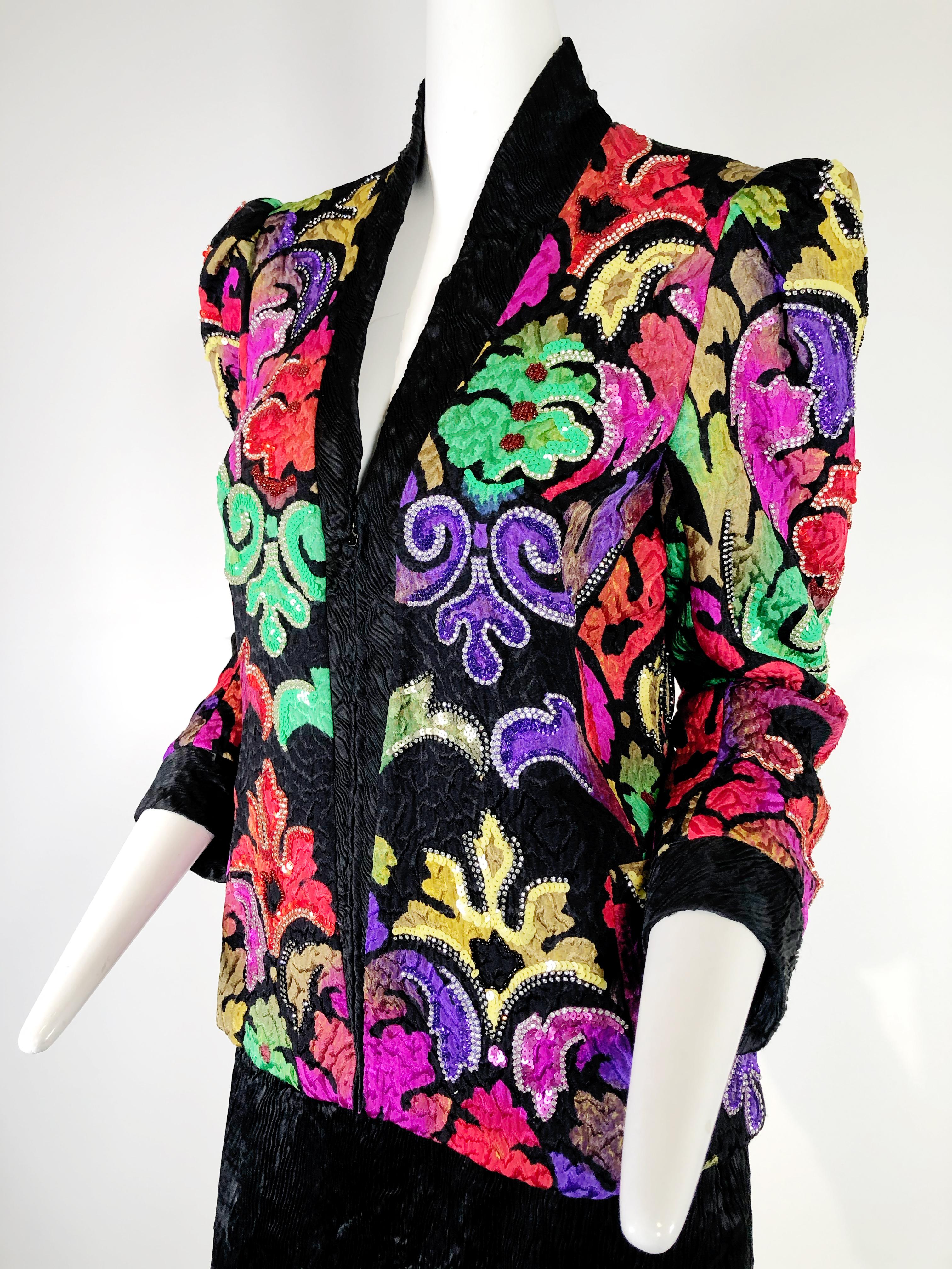 1980s Amen Wardy multi-color silk matelasse evening jacket in a rinceau pattern embellished with sequins and rhinestone trim and styled with a great puffed shoulder silhouette. Fully lined. Zippered front. 