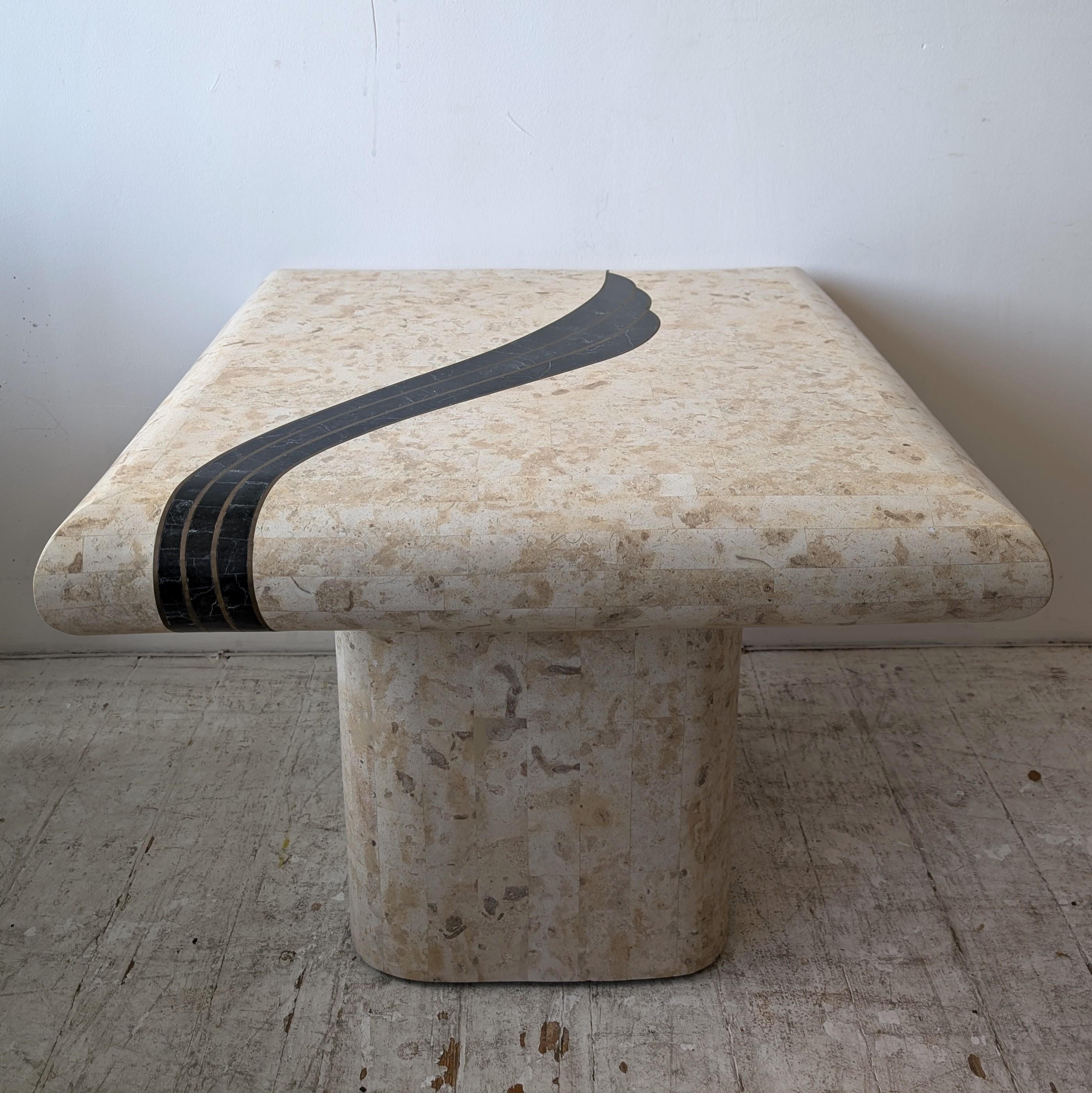 1980s American tessellated stone coffee table with brass and black stone swoosh, by Casa Bisque.

Dimensions: width 66cm, depth 66cm, height 53cm

This is the first of two listings for this table- buyer will pay 2 installments of £247, with my