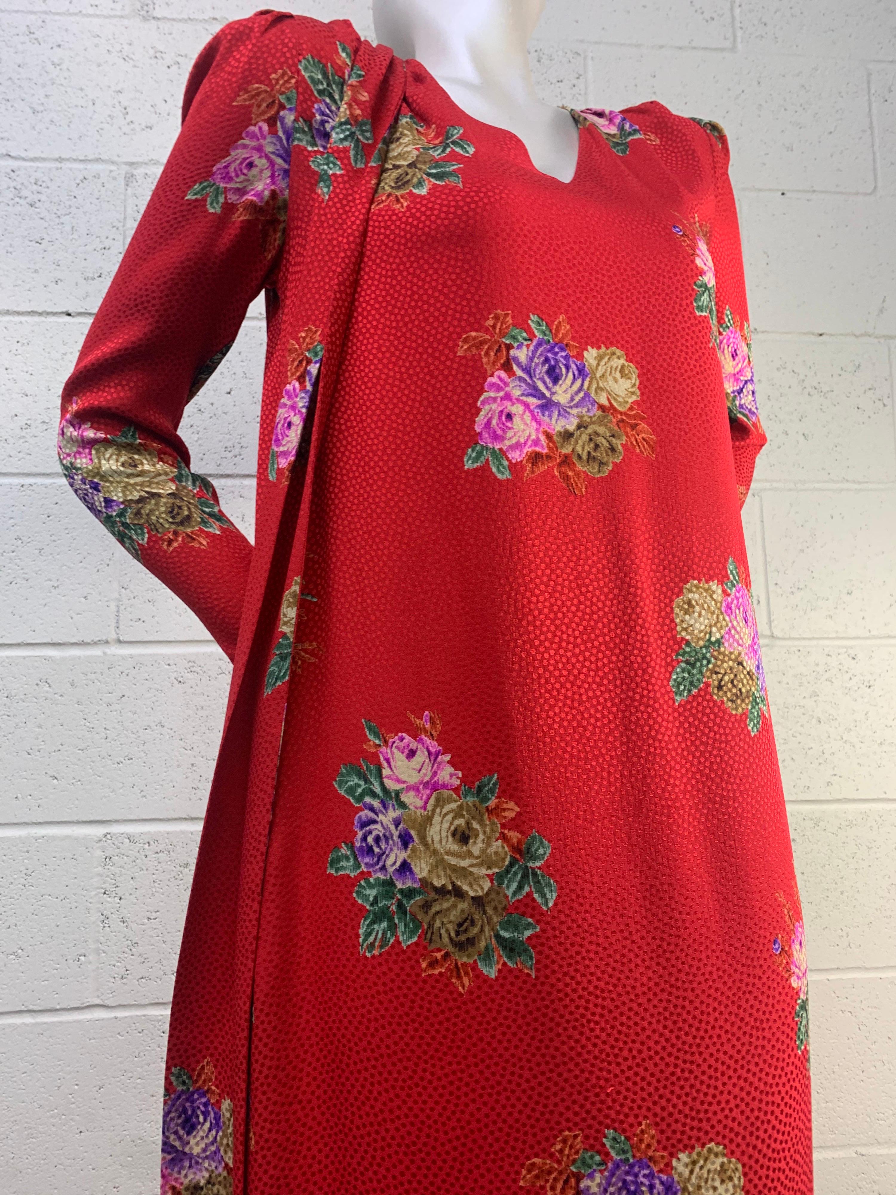 A lovely 1980s Andrea Odicini red and floral silk jacquard print long-sleeved gown with attached foulard. V-neck. Side slit pockets. Straight tunic cut with size vents. Size US 6. 