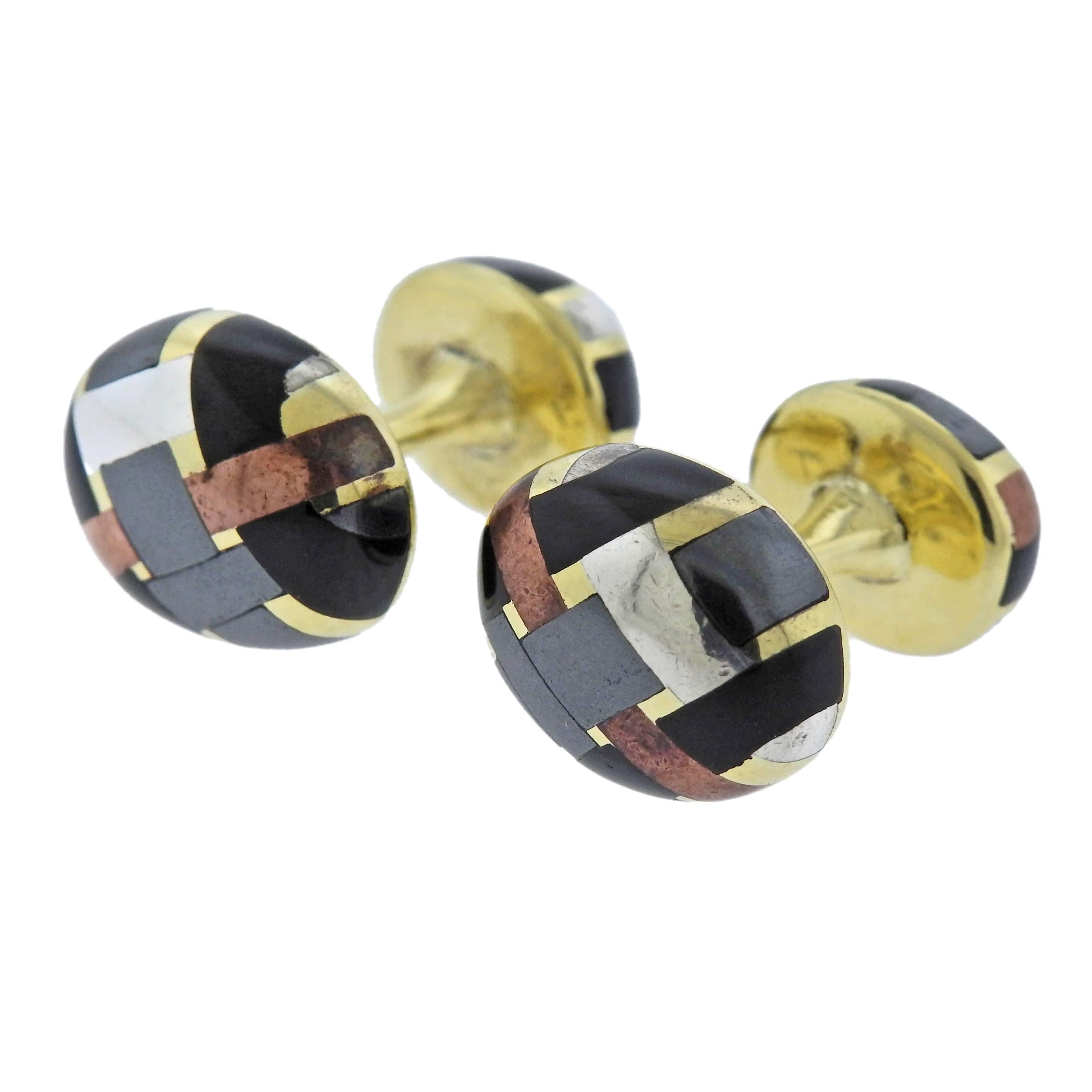 Pair of mixed metal cufflinks, crafted by Angela Cummings in 1984. Cufflink top - 14.6mm x 11.7mm, back - 11.6mm x 9.4mm, weigh 14.4 grams. Marked: 18k, 1984, Angela Cummings.