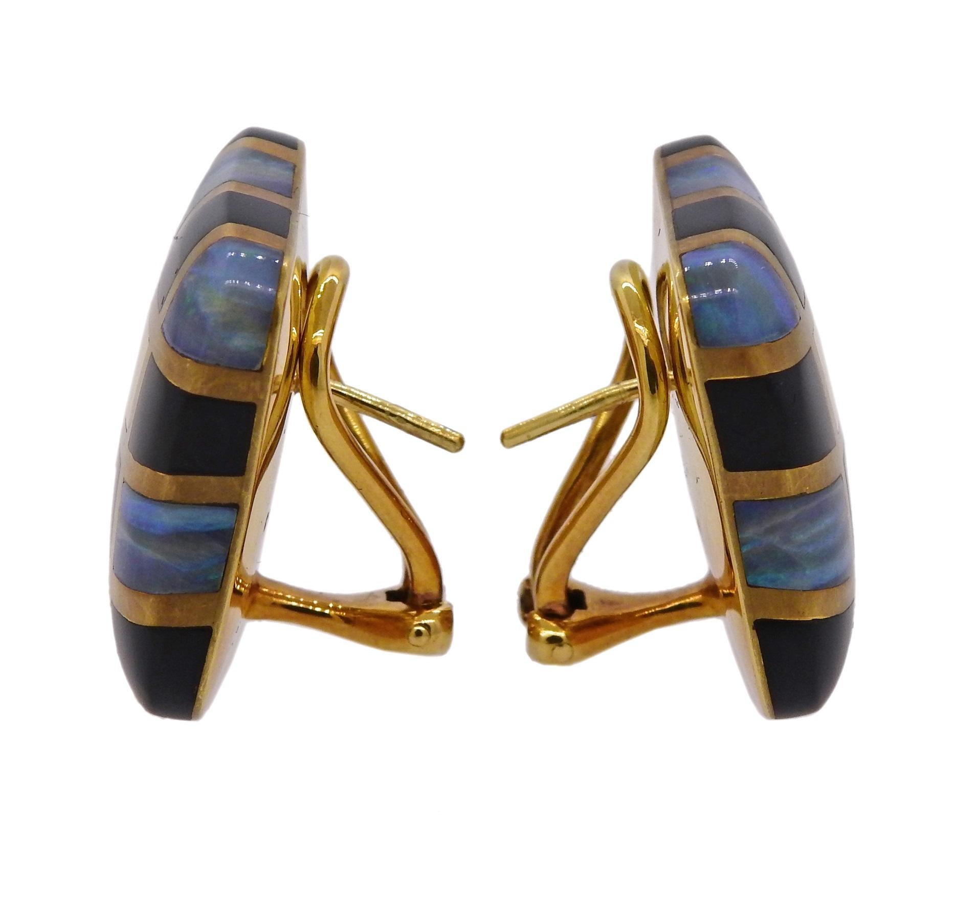 Iconic checkered inlay design earrings, crafted by Angela Cummings in 1984, set with onyx and opal. Earrings are 23mm x 22mm and weigh 24 grams. Marked 18k, Angela Cummings, 1984.