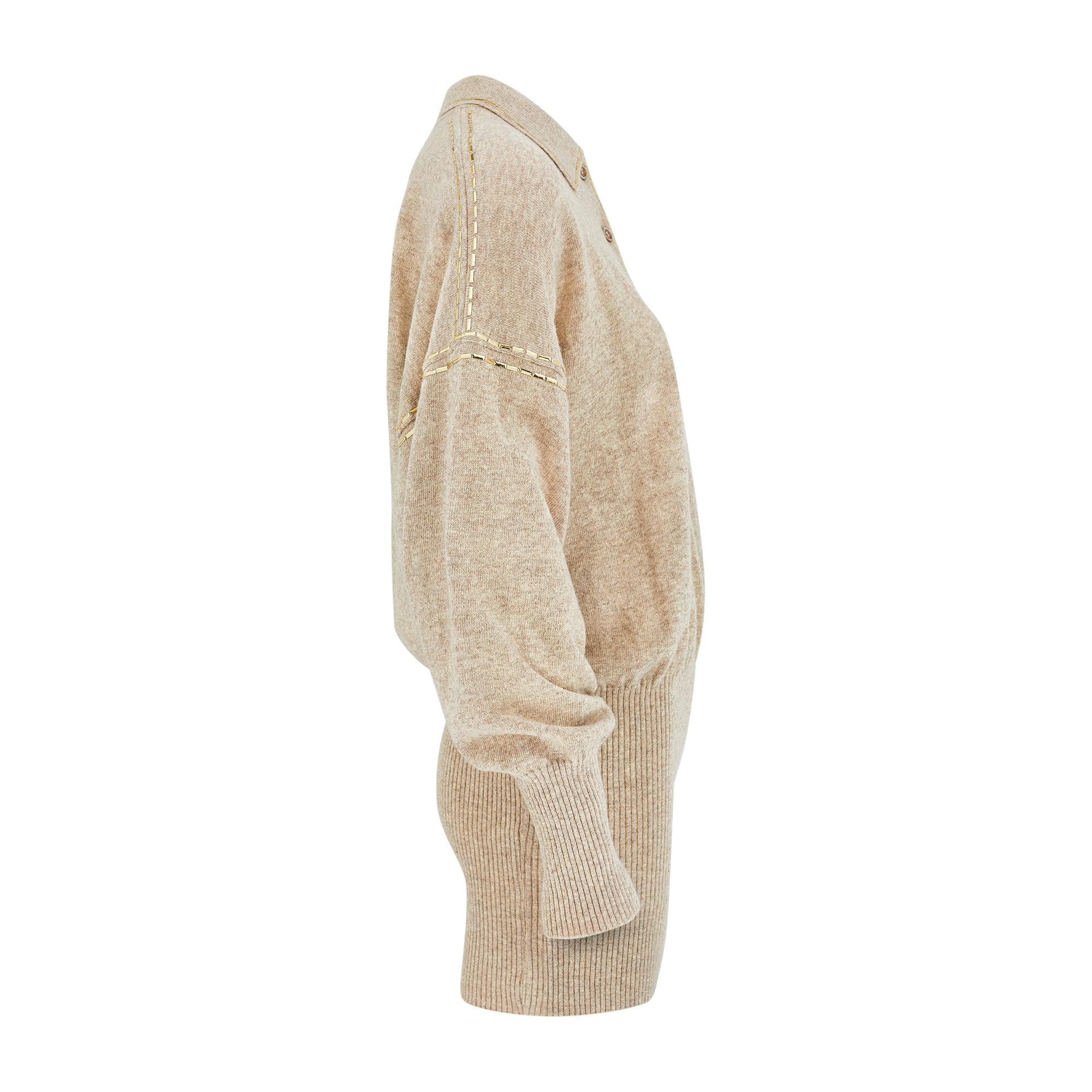 Late 1980s to early 1990s knitted jumper designed by French luxury label Angelo Tariazzi. Woven from pure wool, it is super-soft and has a tight, smooth weave, ribbed at the cuffs. Cut to an elongated, tunic-like length, the bottom hem has an