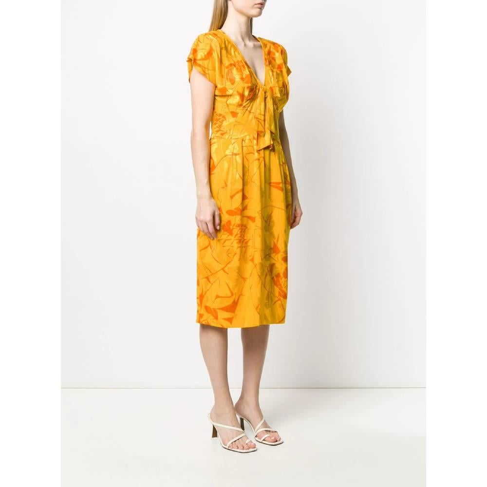 A.N.G.E.L.O. Vintage Cult silk midi dress in navy yellow and orange, V-neckline, decorative bow and short sleeves
Years: 80s  

Size: 42 IT

Linear measures

Height: 112 cm
Bust: 43 cm
Shoulder: 37 cm
Sleeve: 14 cm
Waist: 36 cm