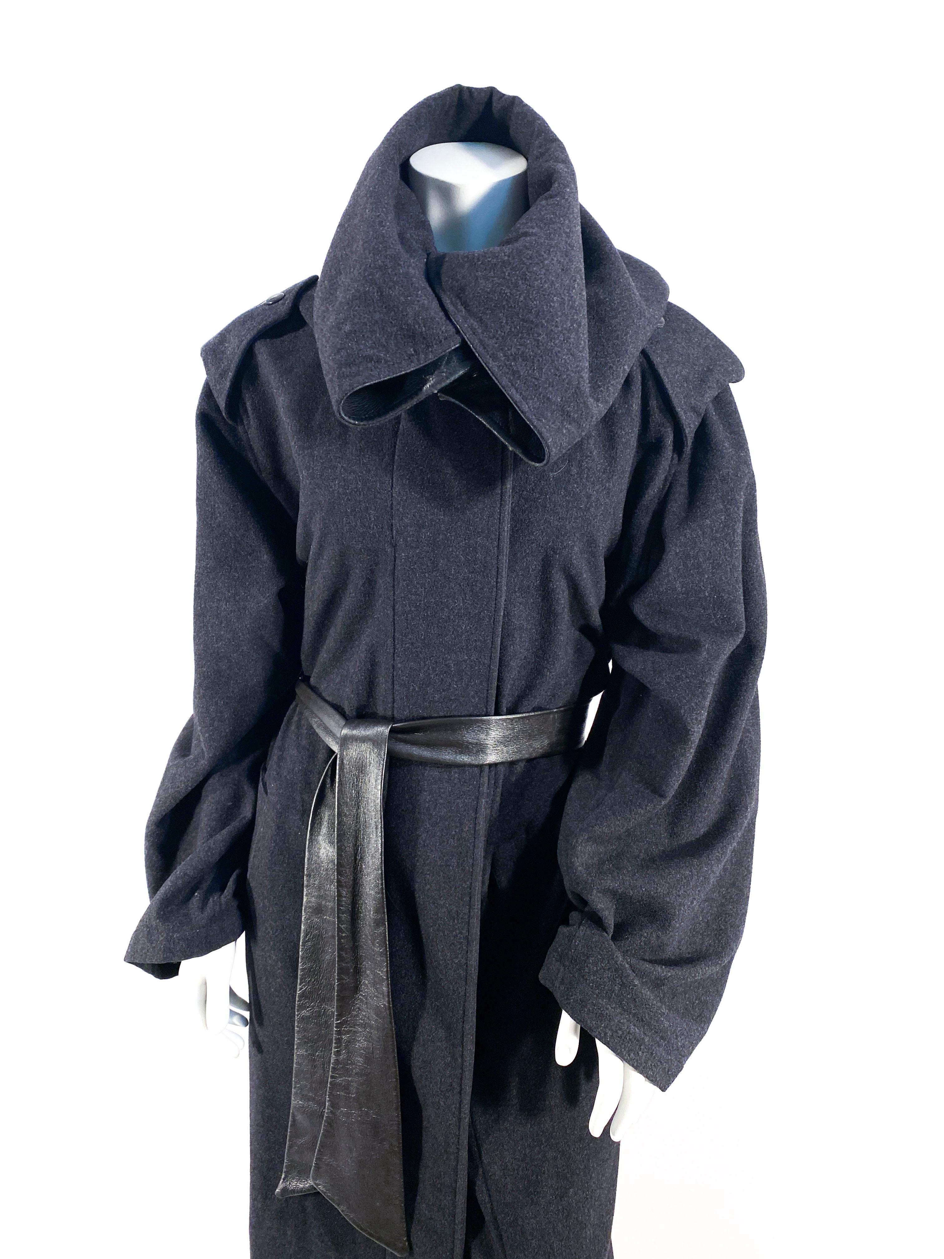 1980s Anne Marie Beretta charcoal grey wool coat with an enlarged rolled collar, oversized pockets, leather sash, snap closures, and a leather lining on the exterior of the collar.