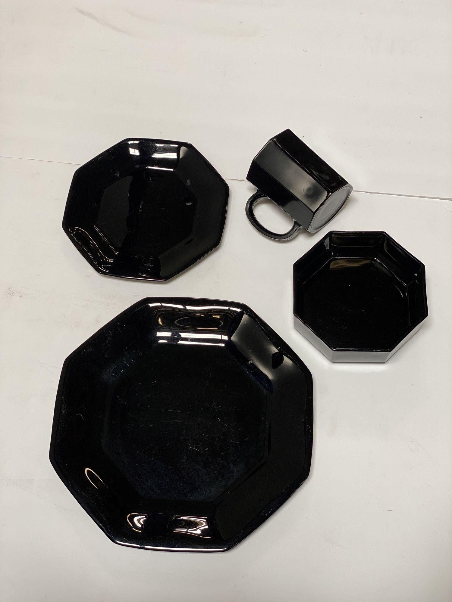 Mid-Century Black Octagonal 20-piece dinnerware set crafted by Arcoroc France.
The set consists of 
6 mugs (4” tall, 3” dia)
7 bowls (6