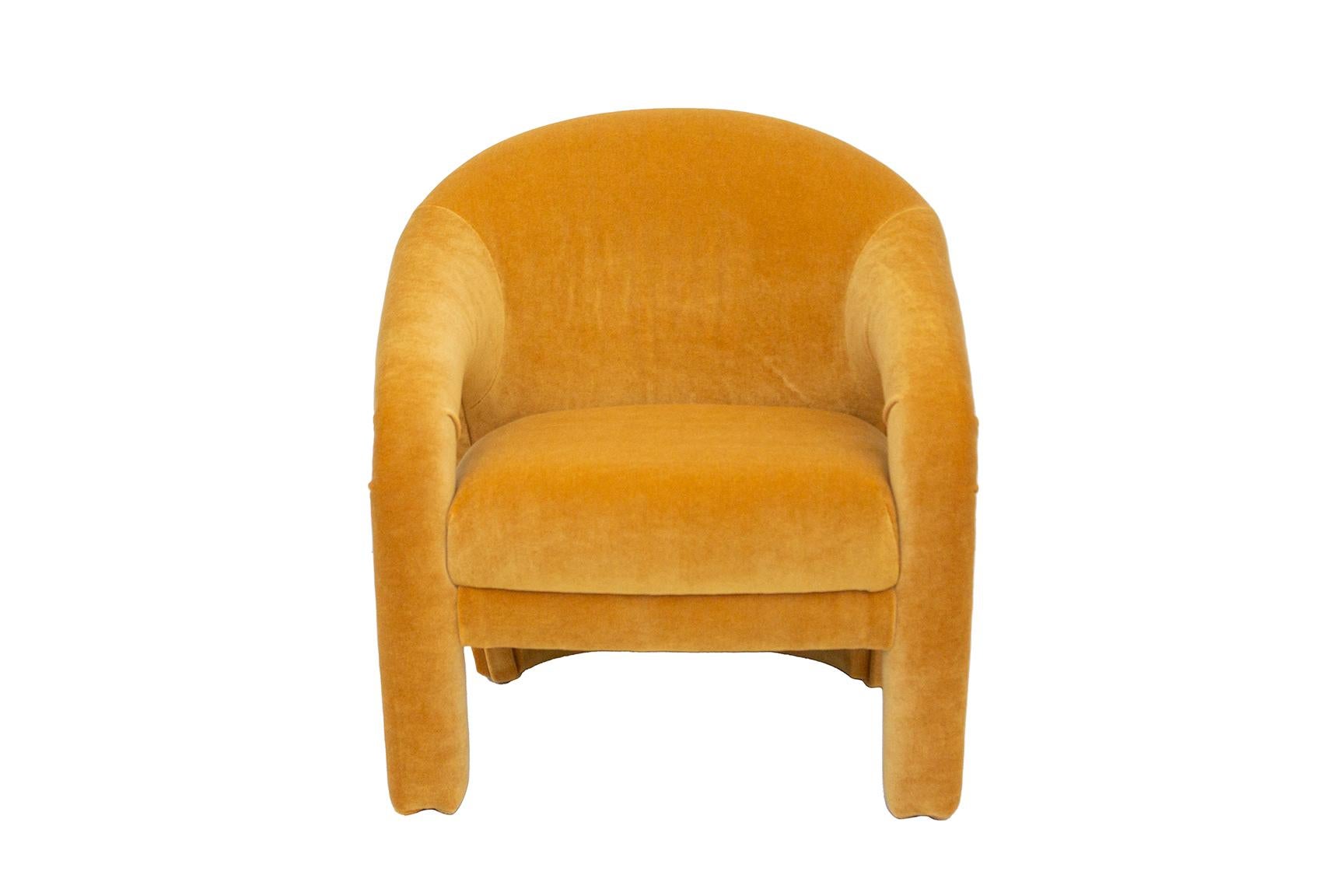 USA, 1980s
Upholstered postmodern armchair by Weiman. Ultra padded back rest, comfortable design with open cutout style arms. Newly reupholstered in a goldenrod velvet. Made by Weiman. 
Dimensions: 31