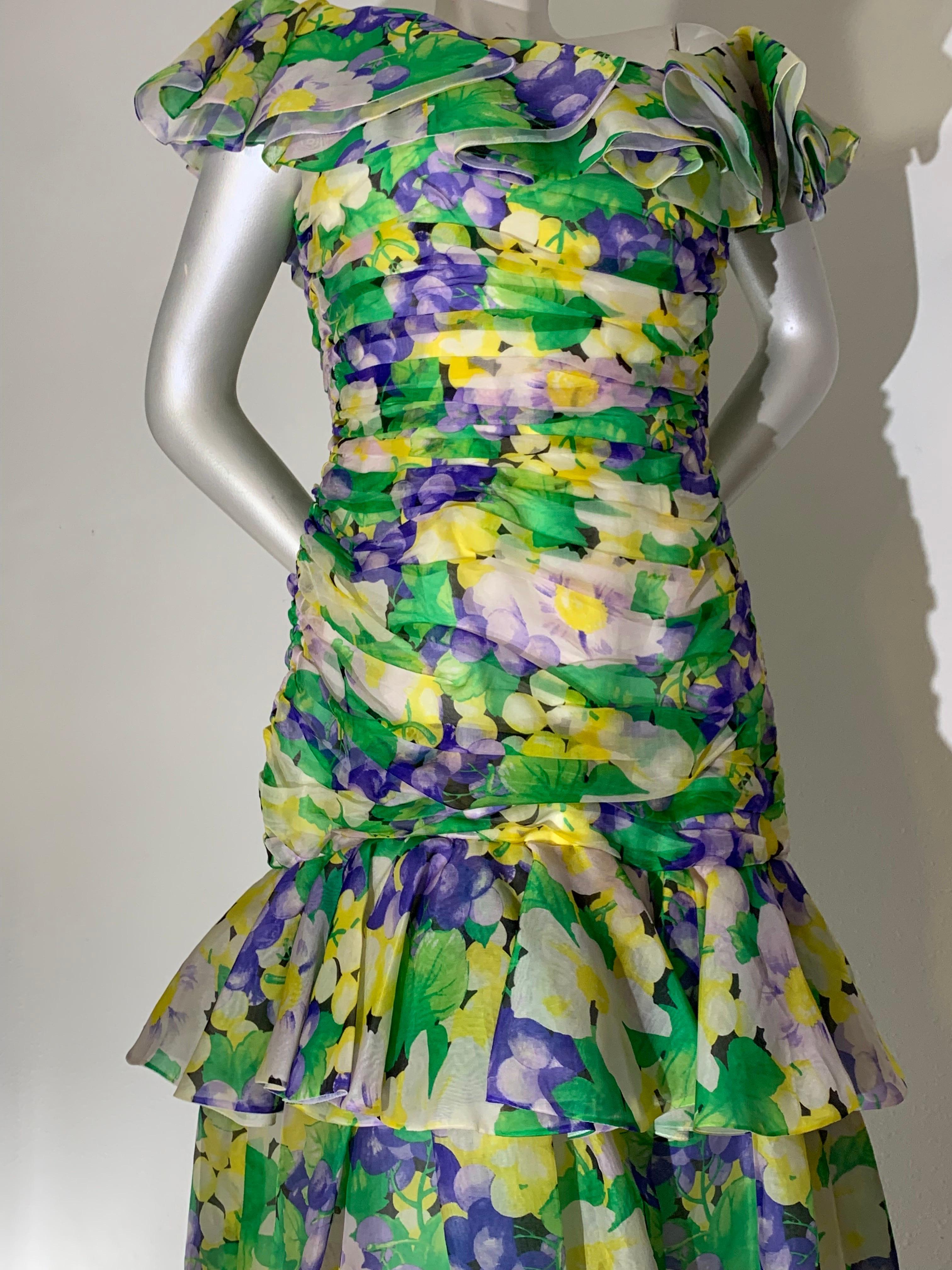 1980s Arnold Scaasi Ruched Silk Organza Summer Floral Print Evening Gown: A fresh floral print in green, lavender and yellow is flirty and flowing with a full fishtail skirt on this 1930s-inspired beauty! Ruffled shoulder and neckline. Fully lined.
