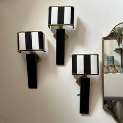 An Elegant 1980s Art Deco Style Black Painted Wood and Brass Italian Wall Sconce