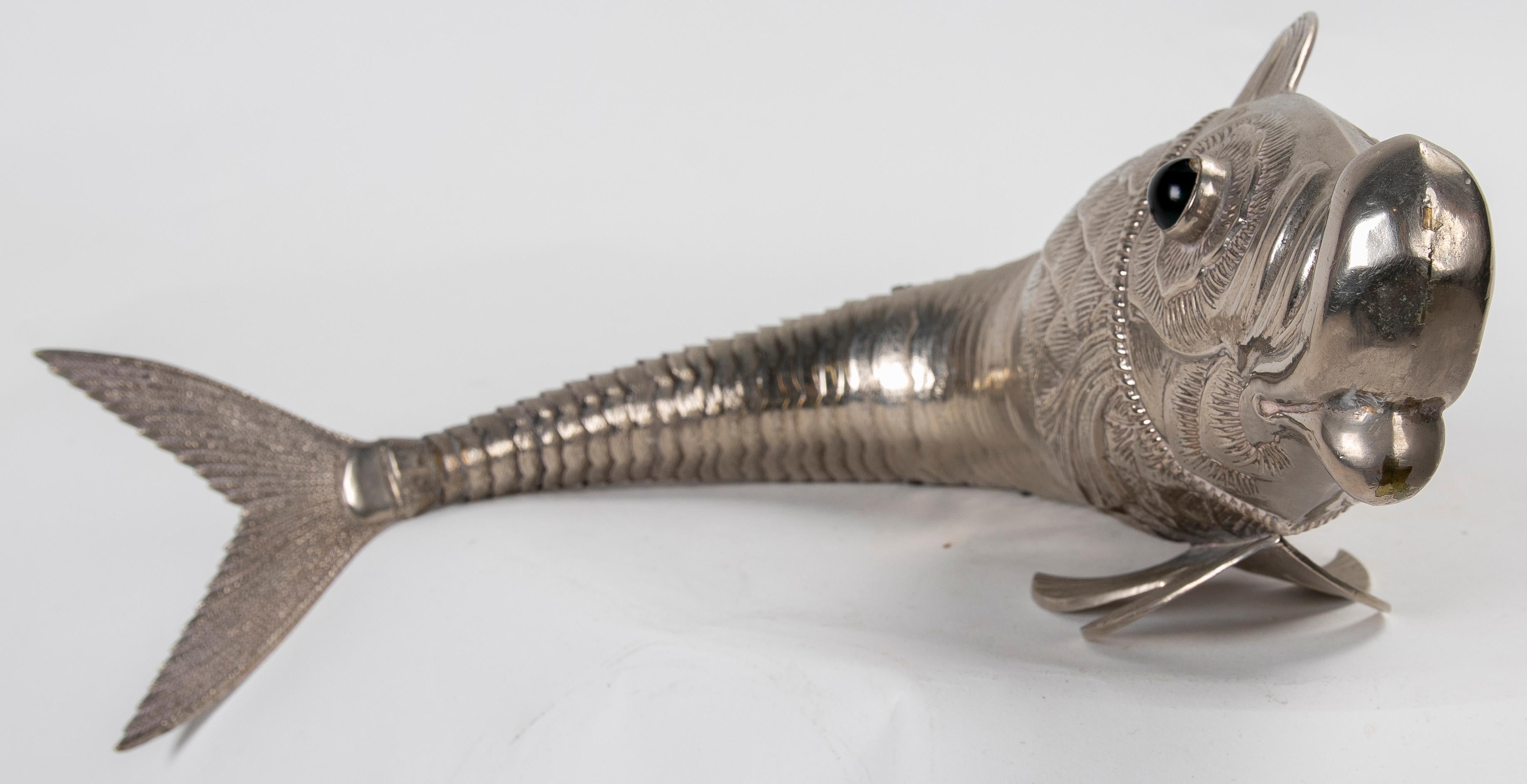 1980s Articulated silver fish with glass eyes.