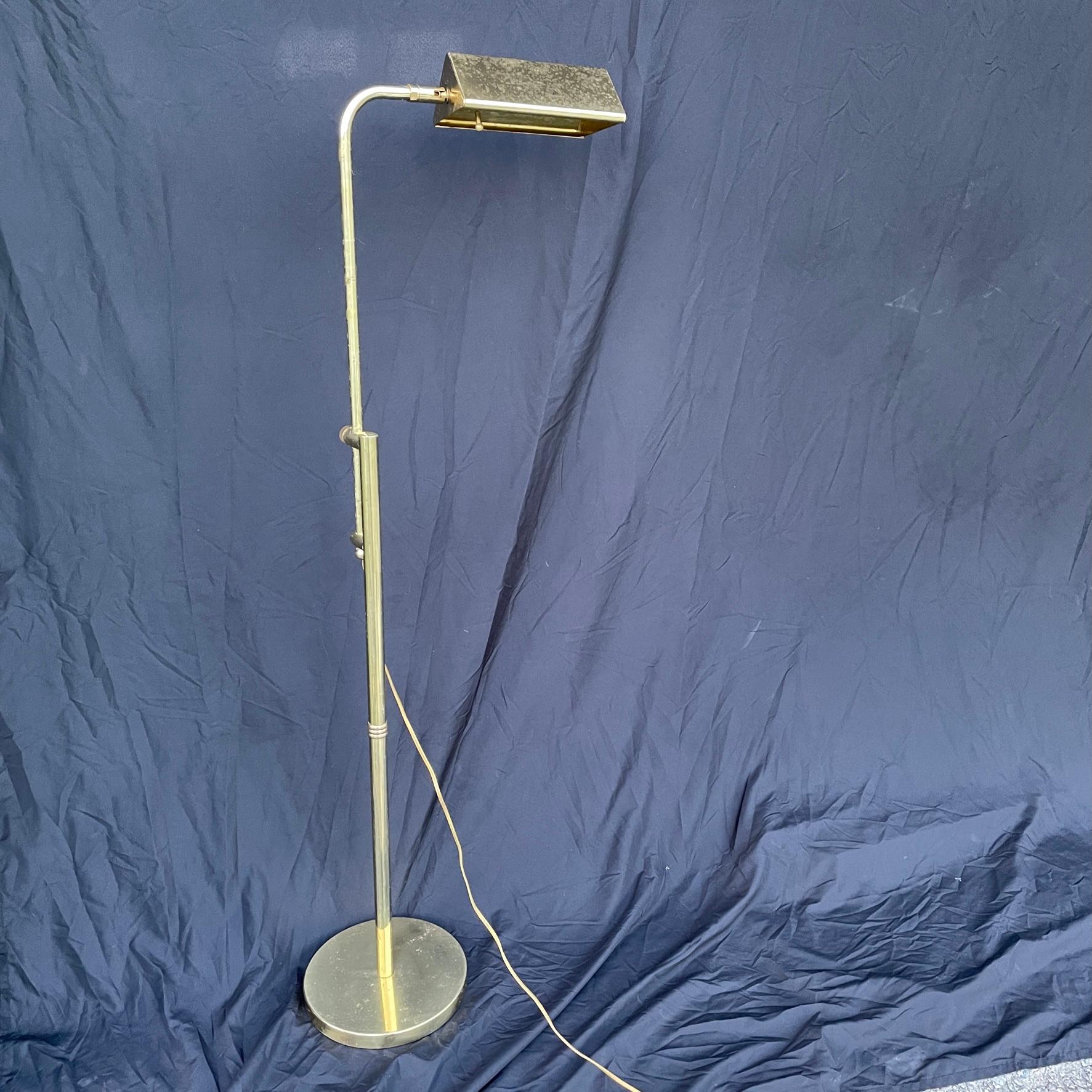 52 1/2 inch height fully extended. Lamp is in working condition. Weighted base. Some spotting on the brass shade. This is photographed. Light articulates in nearly a full circle so you can be sure the lamp will be able to cast light where you need