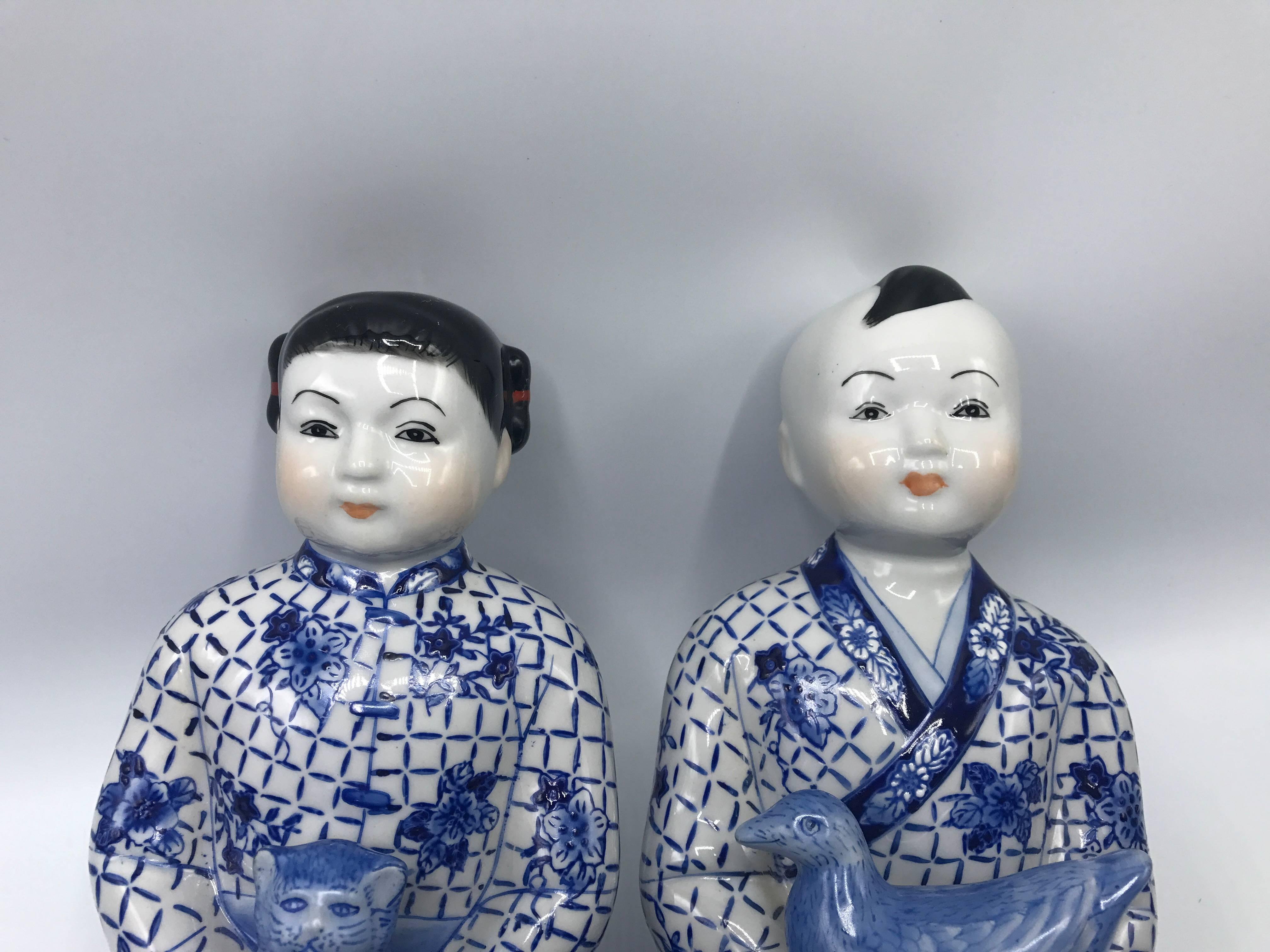 1980s Asian Blue and White Sitting Children Sculptures, Pair In Good Condition In Richmond, VA