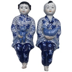 1980s Asian Blue and White Sitting Children Sculptures, Pair
