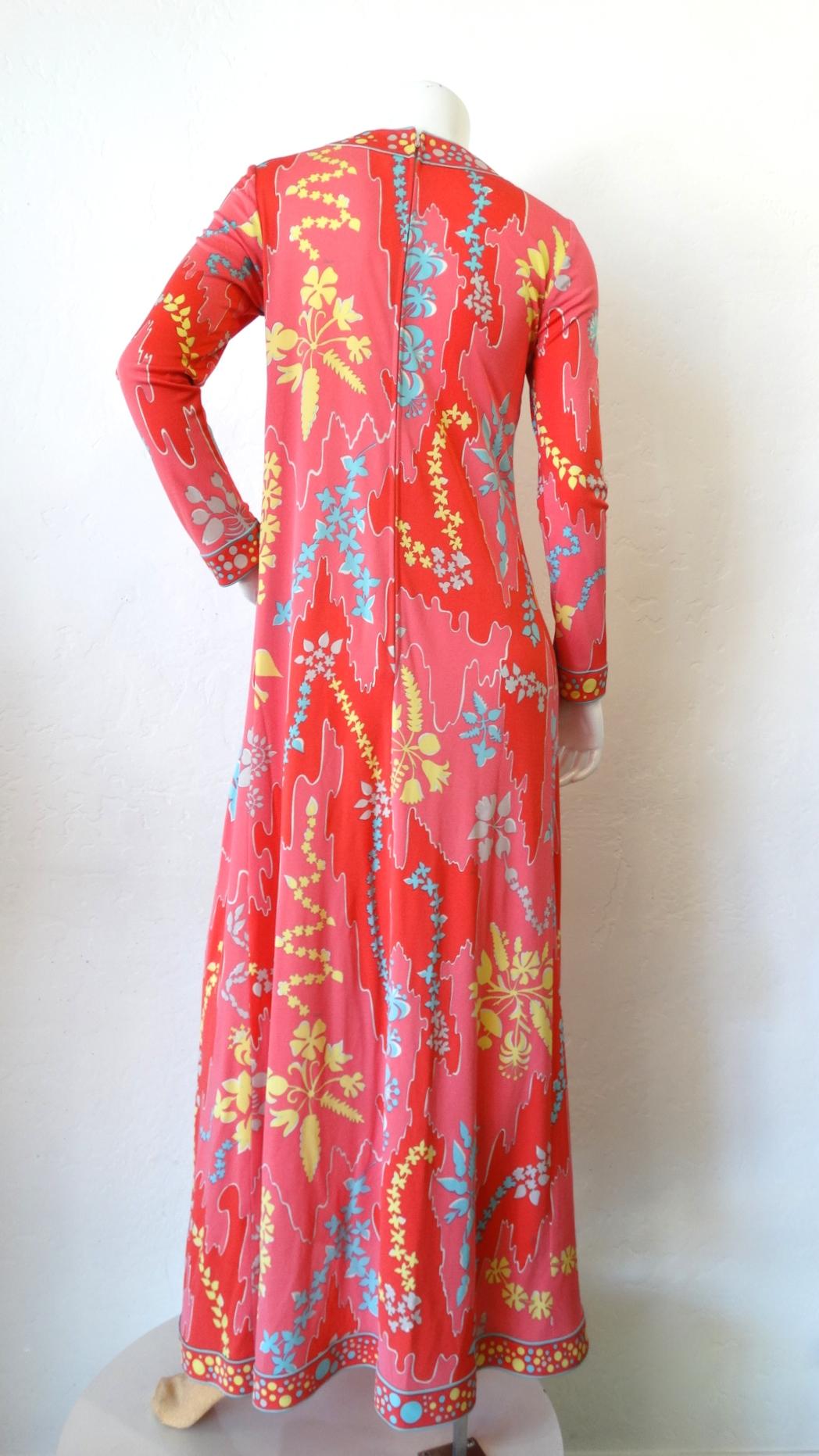 Always Be Ready To Go Out With This Amazing Dress! Circa 1970s, this Averardo Bessi maxi dress features a vibrant motif made up of floral and abstract designs. The high circular neck, cuffs and hem include a polka dot pattern. Zipper in the back.