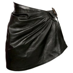 1980's AZZEDINE ALAIA draped black mini skirt with side buckle