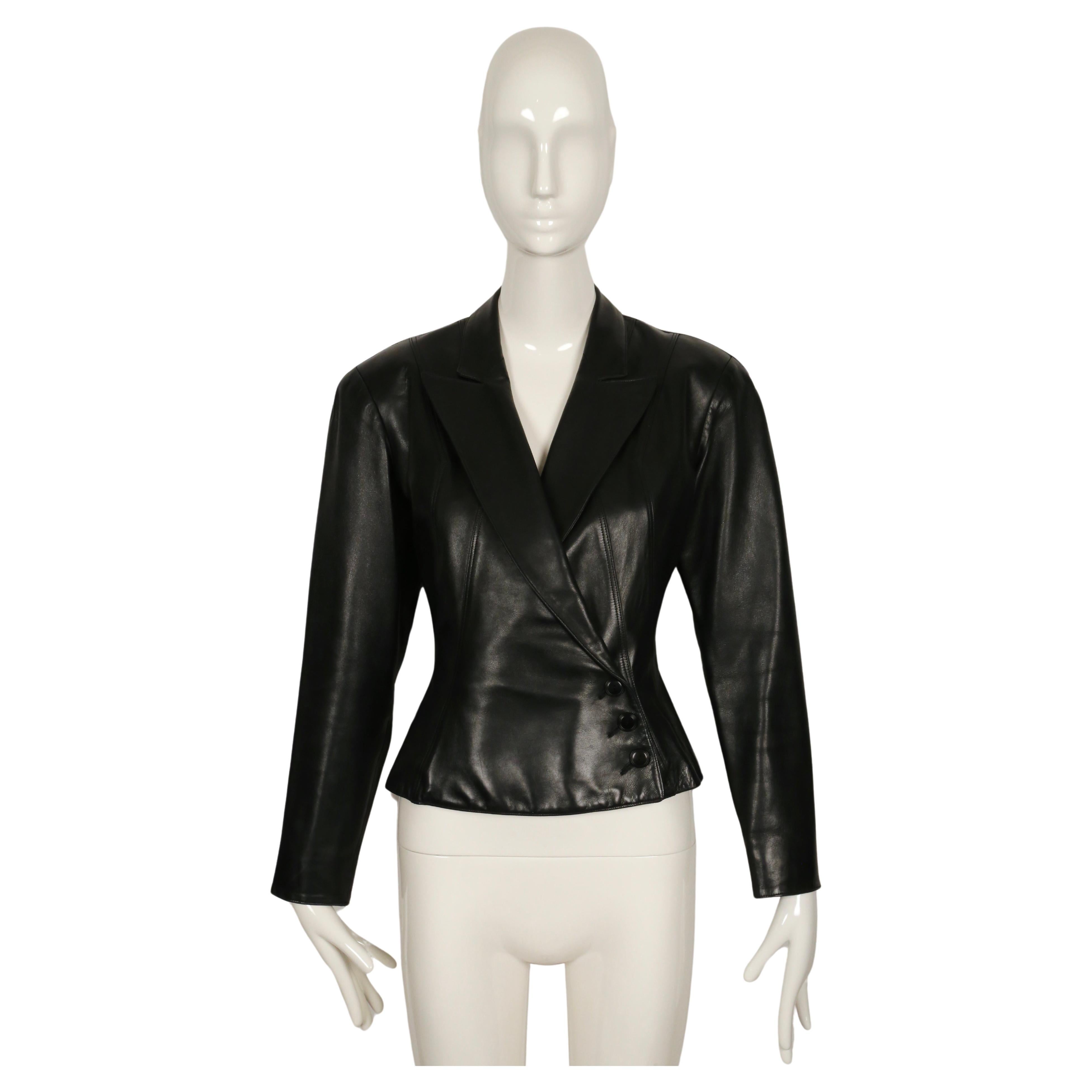 Jet-black, butter-soft leather jacket designed by Azzedine Alaia dating to fall of 1990 exactly as seen on the runway. Jacket has a very flattering silhouette with a fitted waist, slightly flared hemline and beautiful topstitched seams.  Labeled a