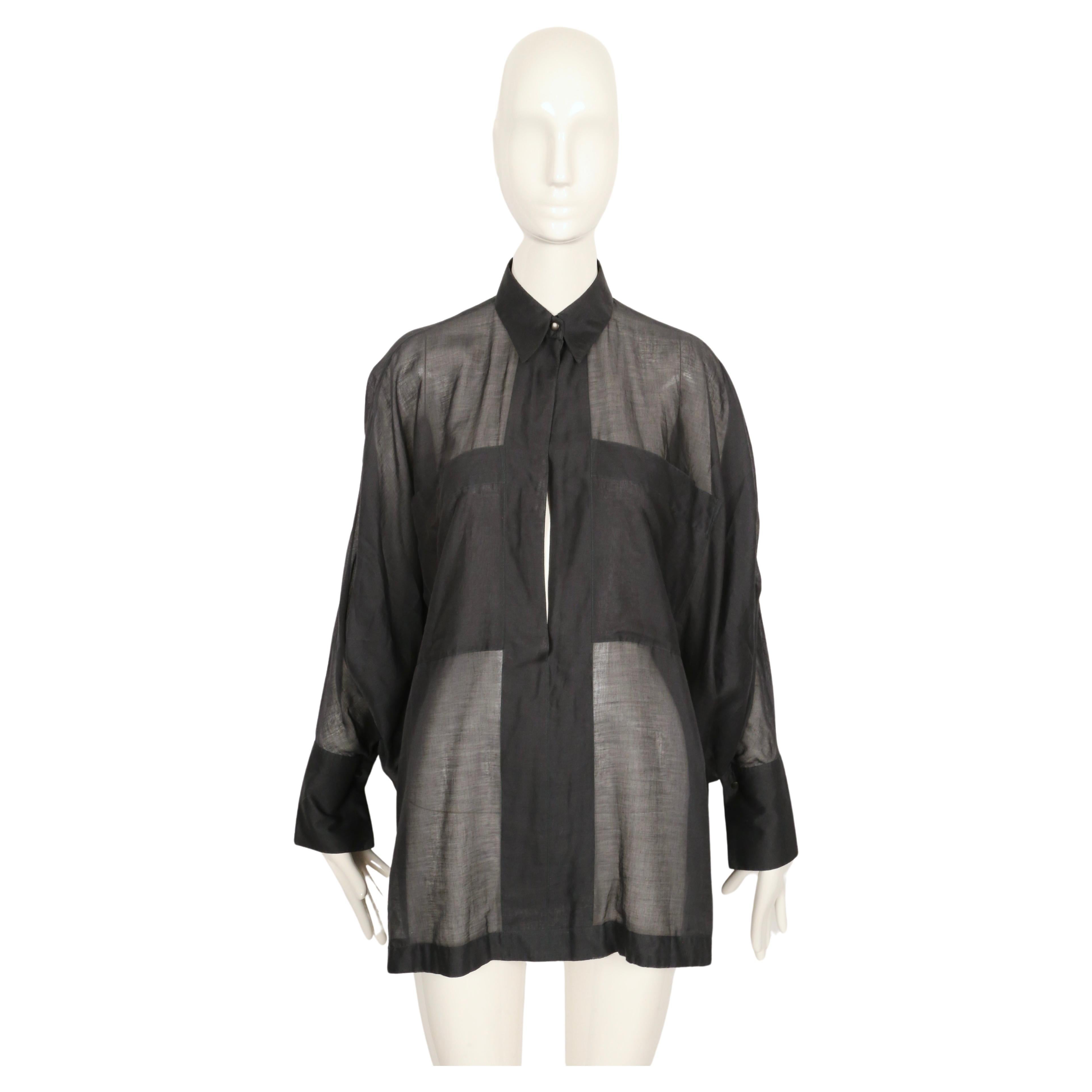 Dark blue-green sheer cotton shirt designed by Azzedine Alaia dating to the 1980's. Strategically placed pockets allow you to wear shirt this without anything under it. Open placket. French size 38. Approximate measurements: neck 13.75