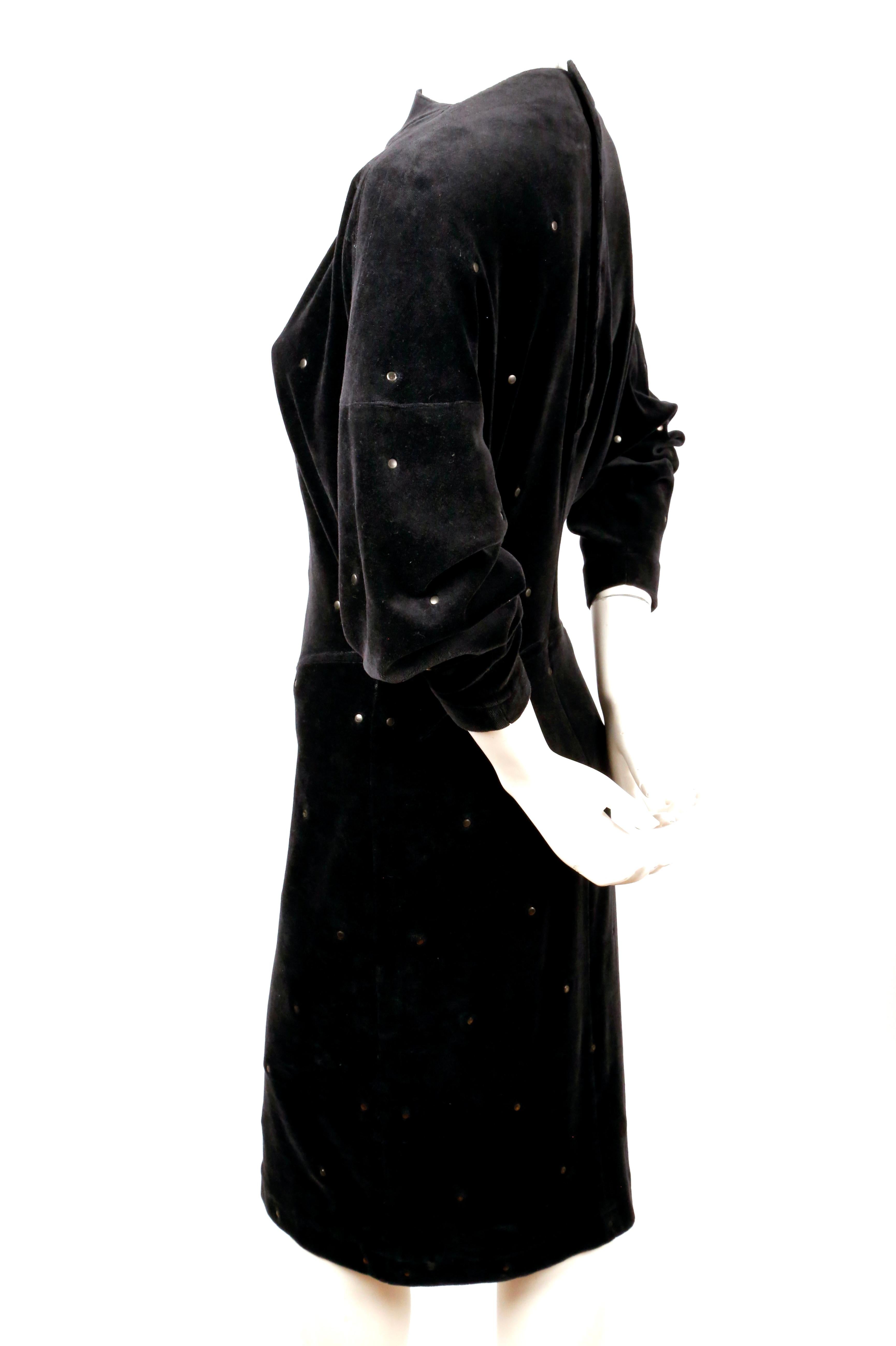 Very rare, black velour dress with studs designed by Azzedine Alaia dating to the early 1980's. Labeled a French size 42 however this was not clipped on the size 2 mannequin. Approximate measurements: waist 28