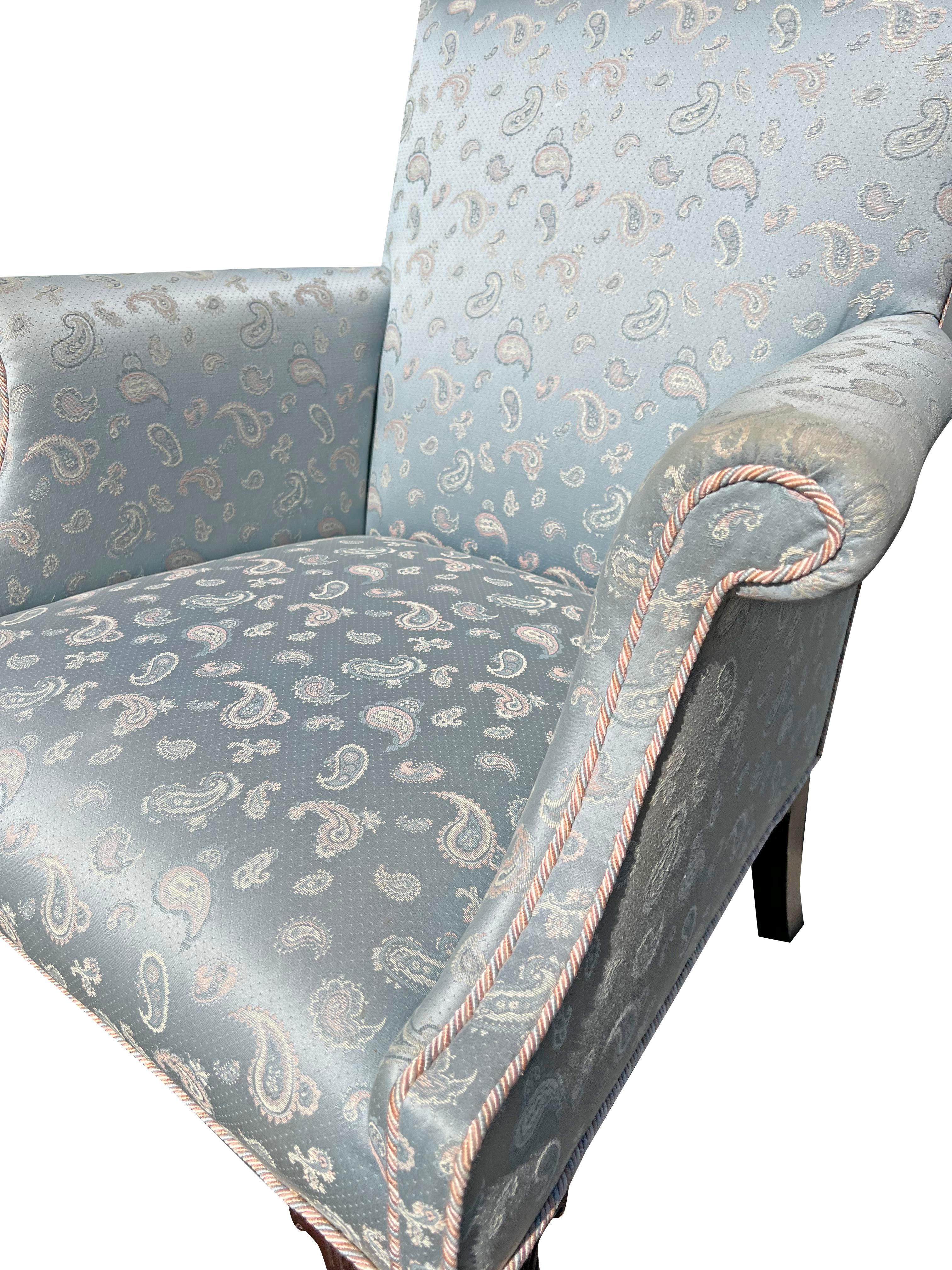 Vintage Baker Style Accent Side Chair

This elegant vintage accent chair showcases a captivating paisley pattern upholstery in shades of light blue, pink, and white. The chair's design is reminiscent of the renowned Baker Furniture Company, known