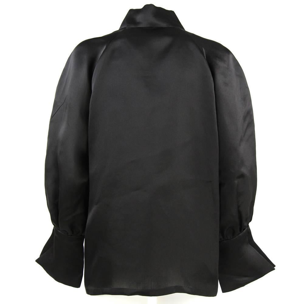 Amazing black silk satin jacket by Balenciaga Les Dix. Created in the 1980s.
No front buttons.
Measurements:
length: 71 cm
sleeve: 64 cm