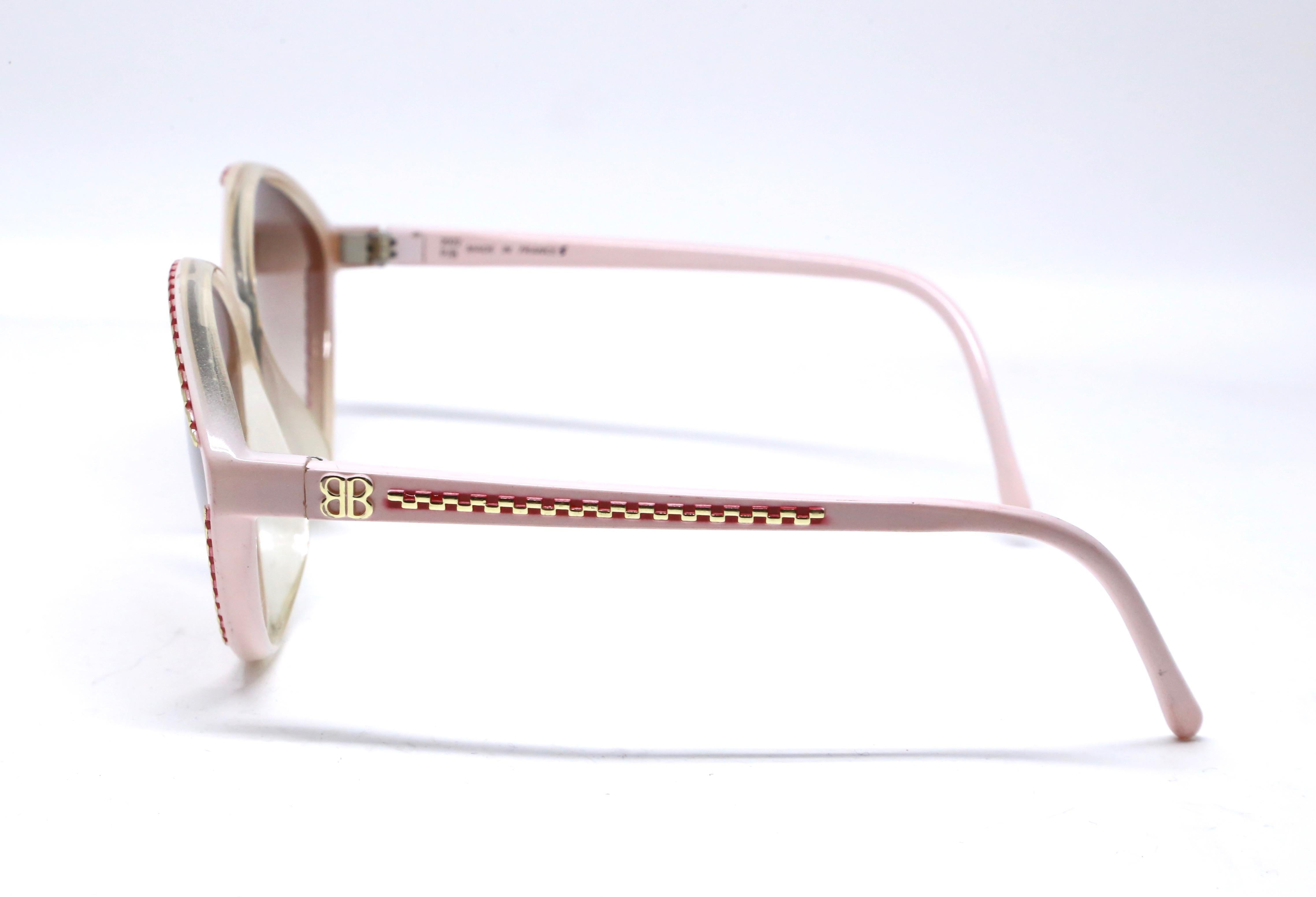 Beige 1980's BALENCIAGA pink and burgundy plastic sunglasses with gold accents