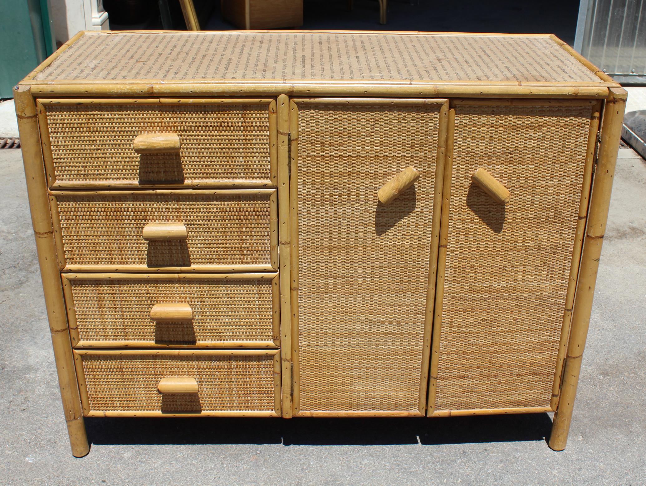 1980s bamboo and rattan chest with five drawers and two cabinet doors.