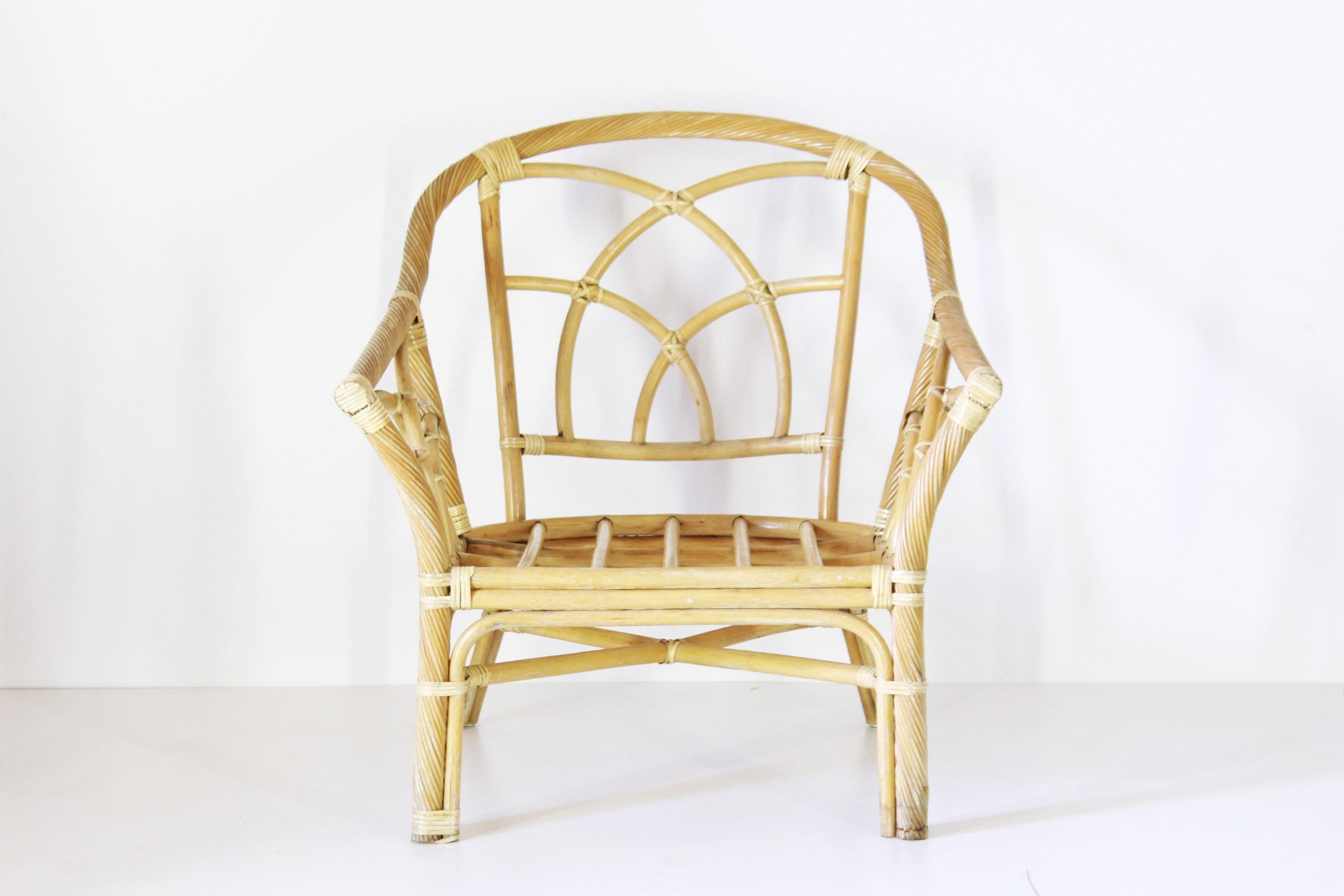 A 1980s vintage bamboo armchair. In very good conditions with only few signs of time.