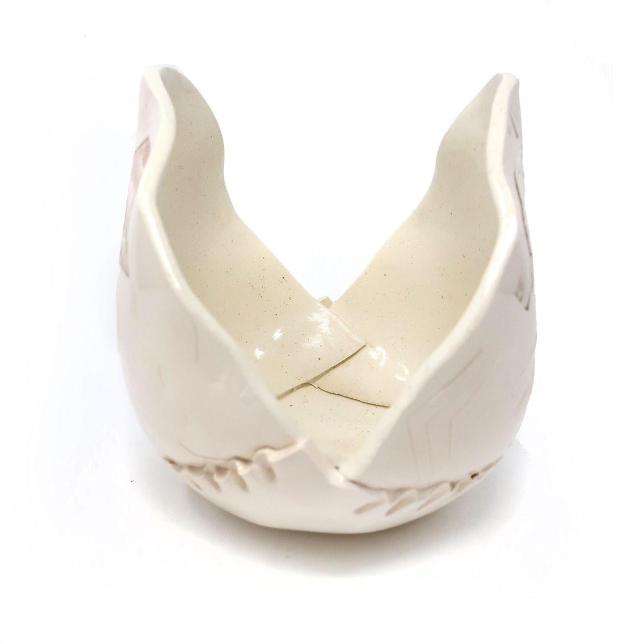A decorative handmade ceramic vase by Barbary Demery. Covered in playful pastels, unique glaze combinations, and repetitive geometric patterns that give it a distinctly 1980s look. Its open design comes together in a tulip-like shape to create a