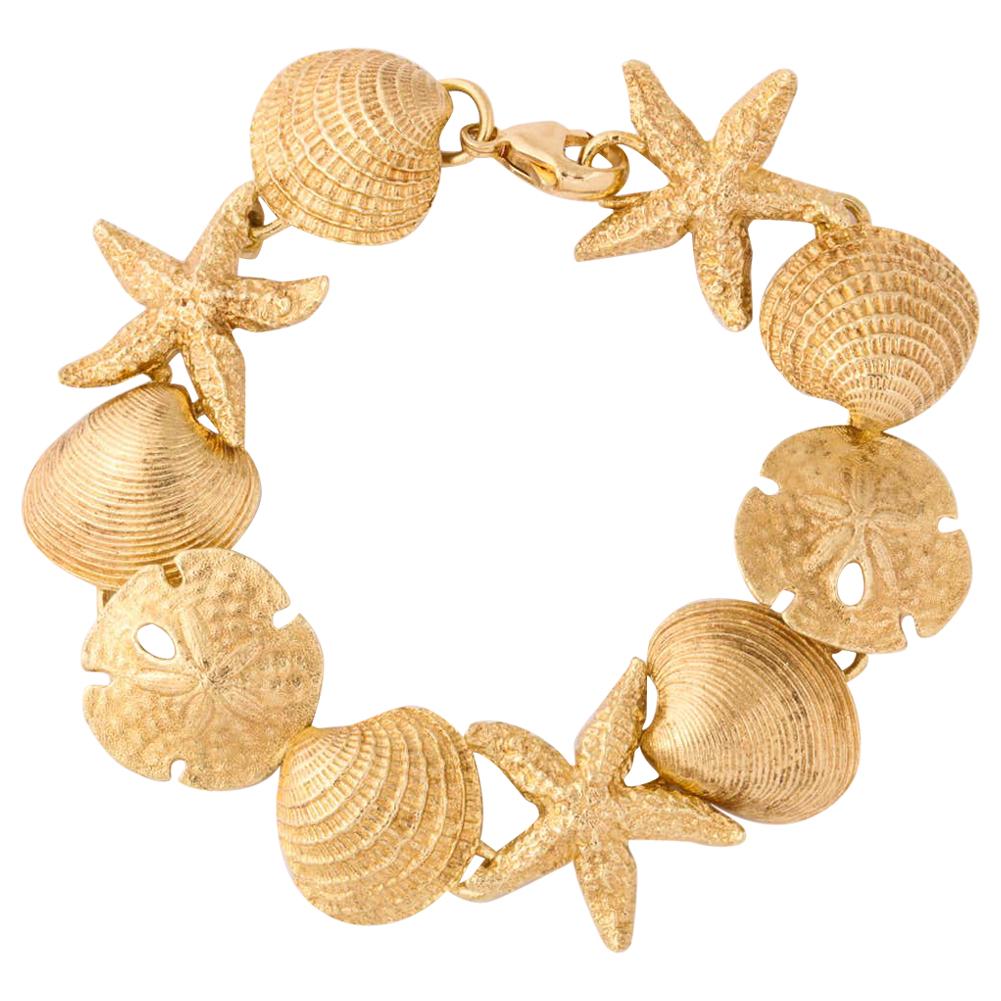 1980's Beach Motif Lily Pad, Starfish and Shell Gold Flexible Link Bracelet For Sale