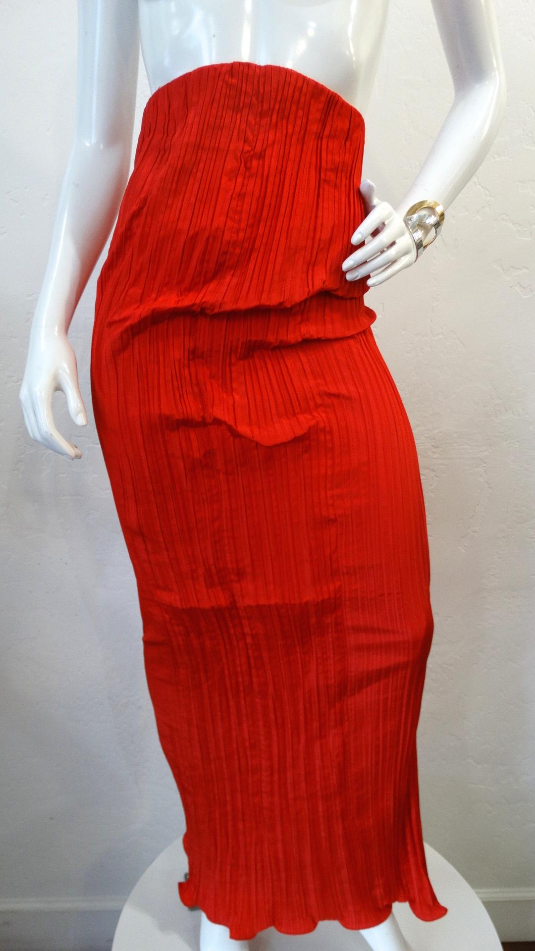 Make A Statement With This Amazing Piece! Circa late 1980s, this Bernard Perris couture pleated silk crepe skirt is a vibrant red color and features an arched high waisted top hem. Floor length with a slight ruffled hem and a tonal zipper in the