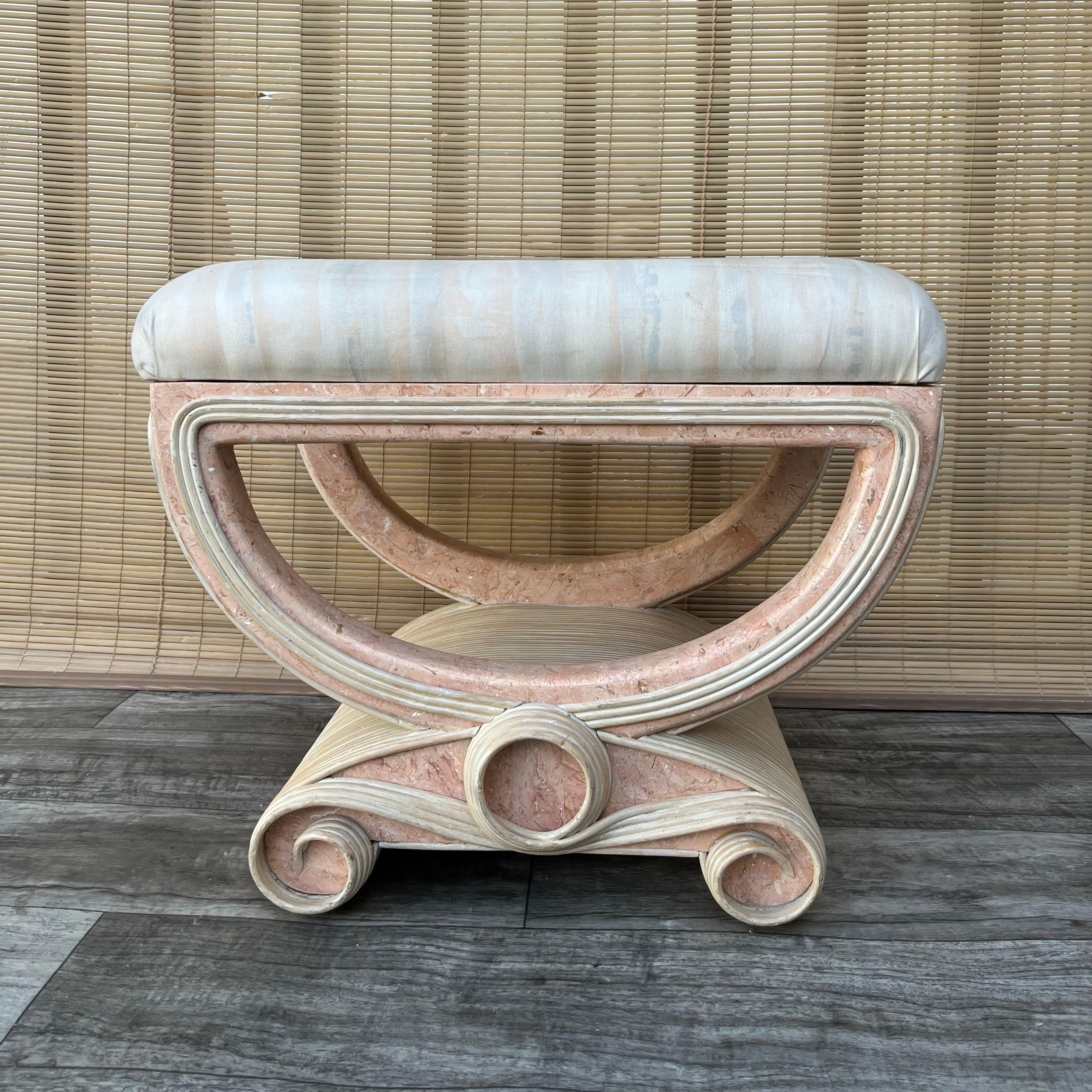 Vintage Post Modern/ Palm Beach Regency Style Pencil Reed and Tessellated Stone Bench in the Betty Cobonpue's Manner. Circa 1980s 
Features a polished pink tessellated stone base with an elegant pencil reed scrolls detailing. 
In excellent original