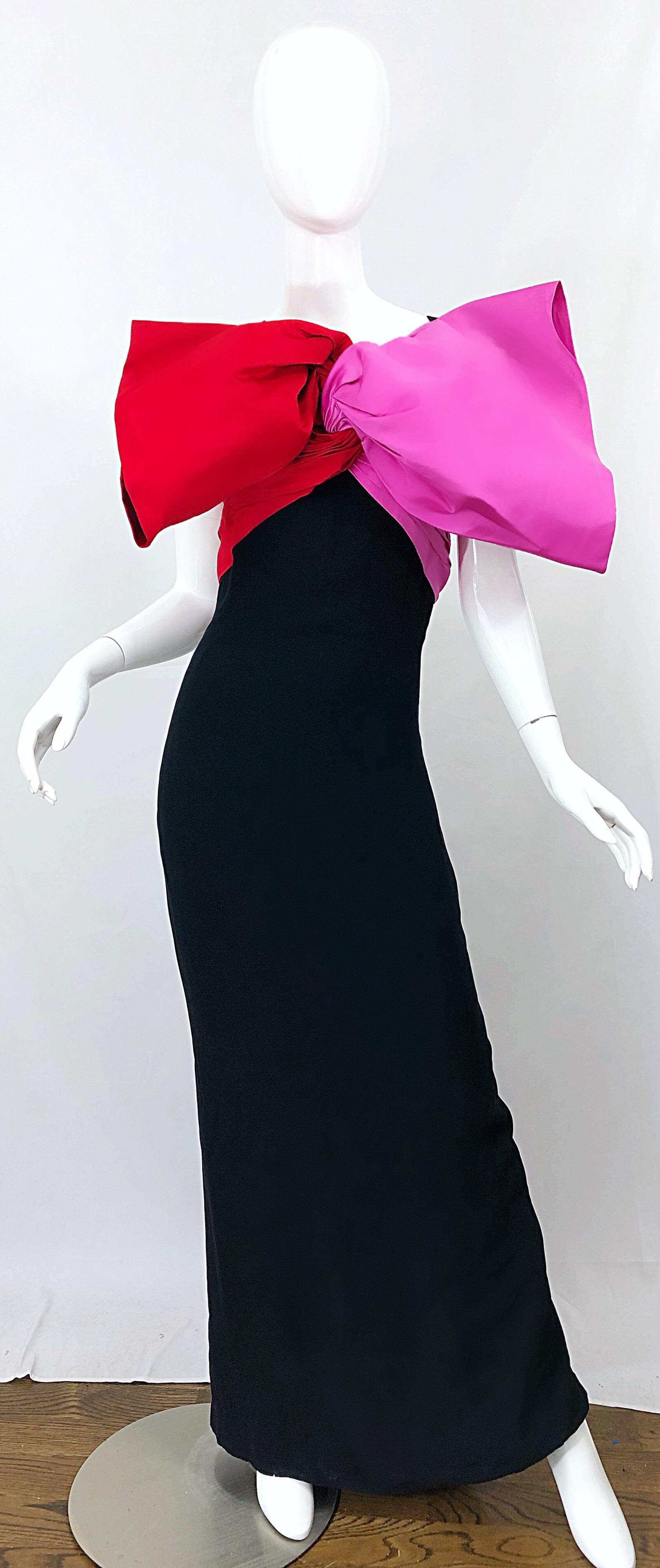 Avant Garde BILL BLASS Couture bow gown! Features black rayon with a large hot pink and red satin bow at the bust. From the front, the dress looks strapless. Two straps on the back with matching color blocked ruched satin. Built in interior support