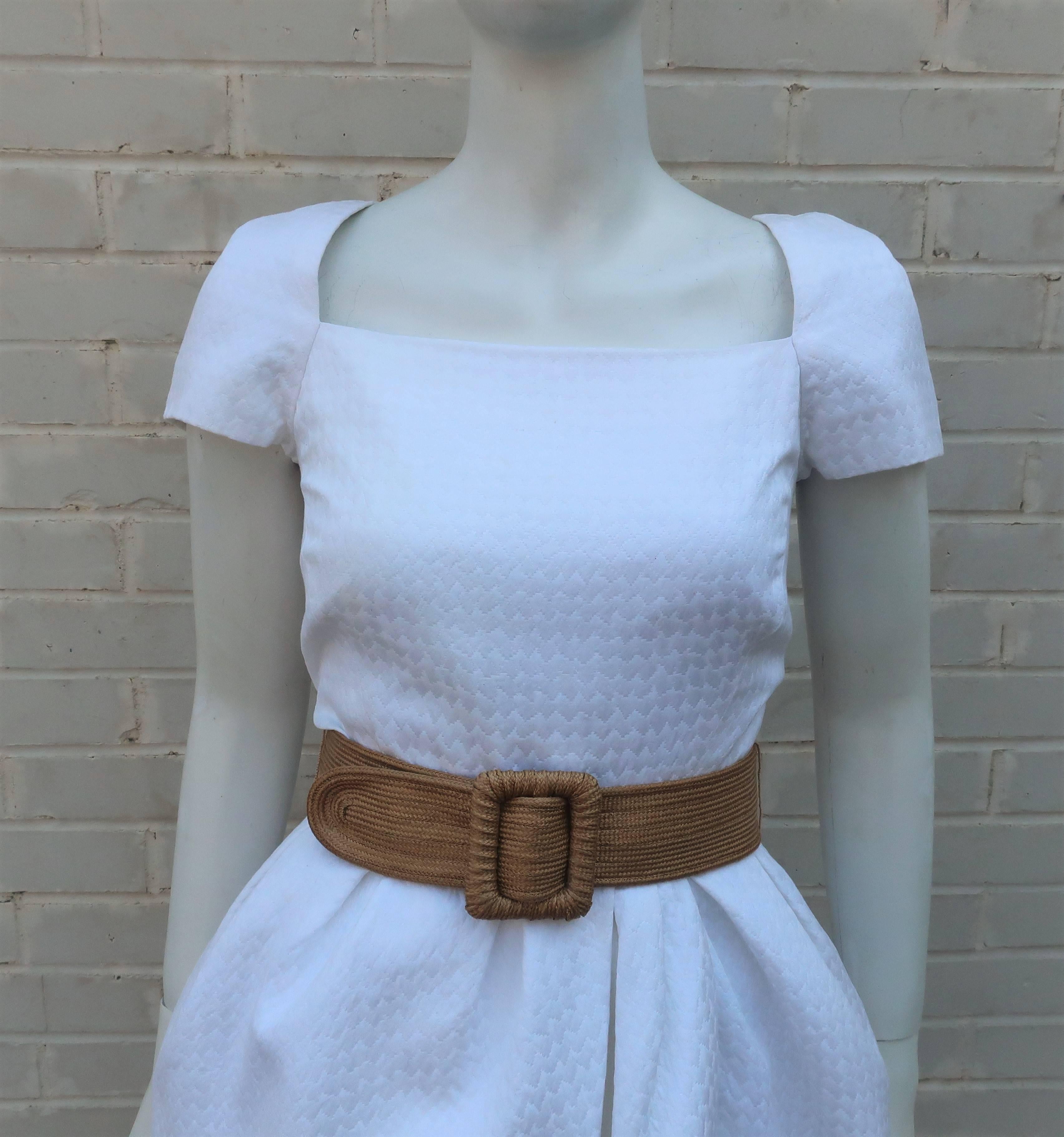 Bill Blass always had a talent for creating luxurious designs for sophisticated women with an eye for style.  This 1980's dress has a youthful aesthetic with capped sleeves, a cinched waist, pockets and a fun tulip style skirt that bubbles with