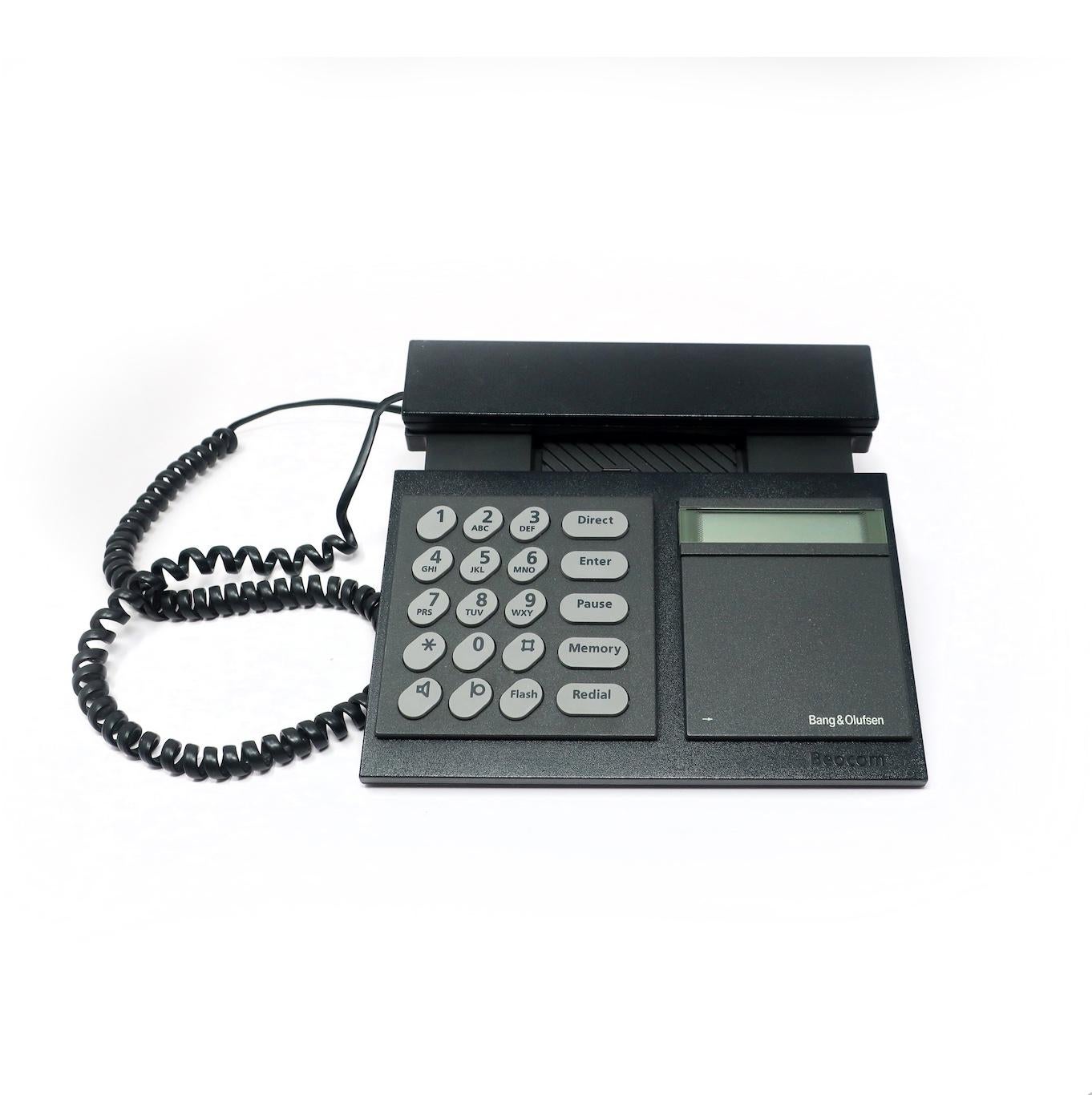 Designed in 1986 by Lone and Gideon Lindinger-Lowy, the Bang & Olufsen Beocom 2000 telephone is Danish design at its finest, and the epitome of 1980s high-tech and high design. It has a black handset and base with gray buttons. 

In vintage
