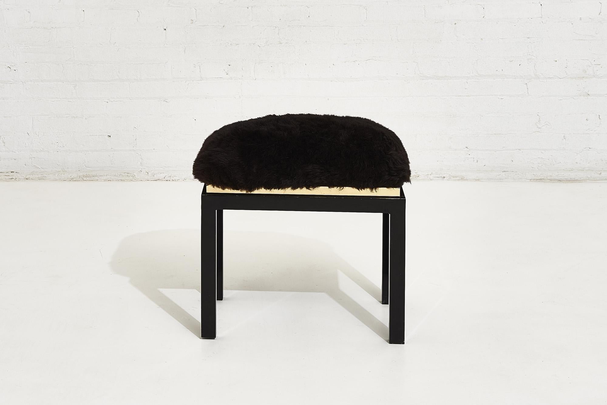1980’s black black brass fur stool.
Black enameled finish with brass trim and furry sheep skin upholstery.
