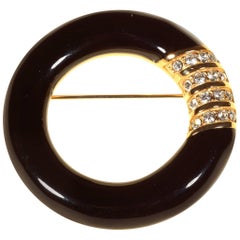 Vintage 1980
s Black Enamel Circle Brooch by Swarovski America Limited