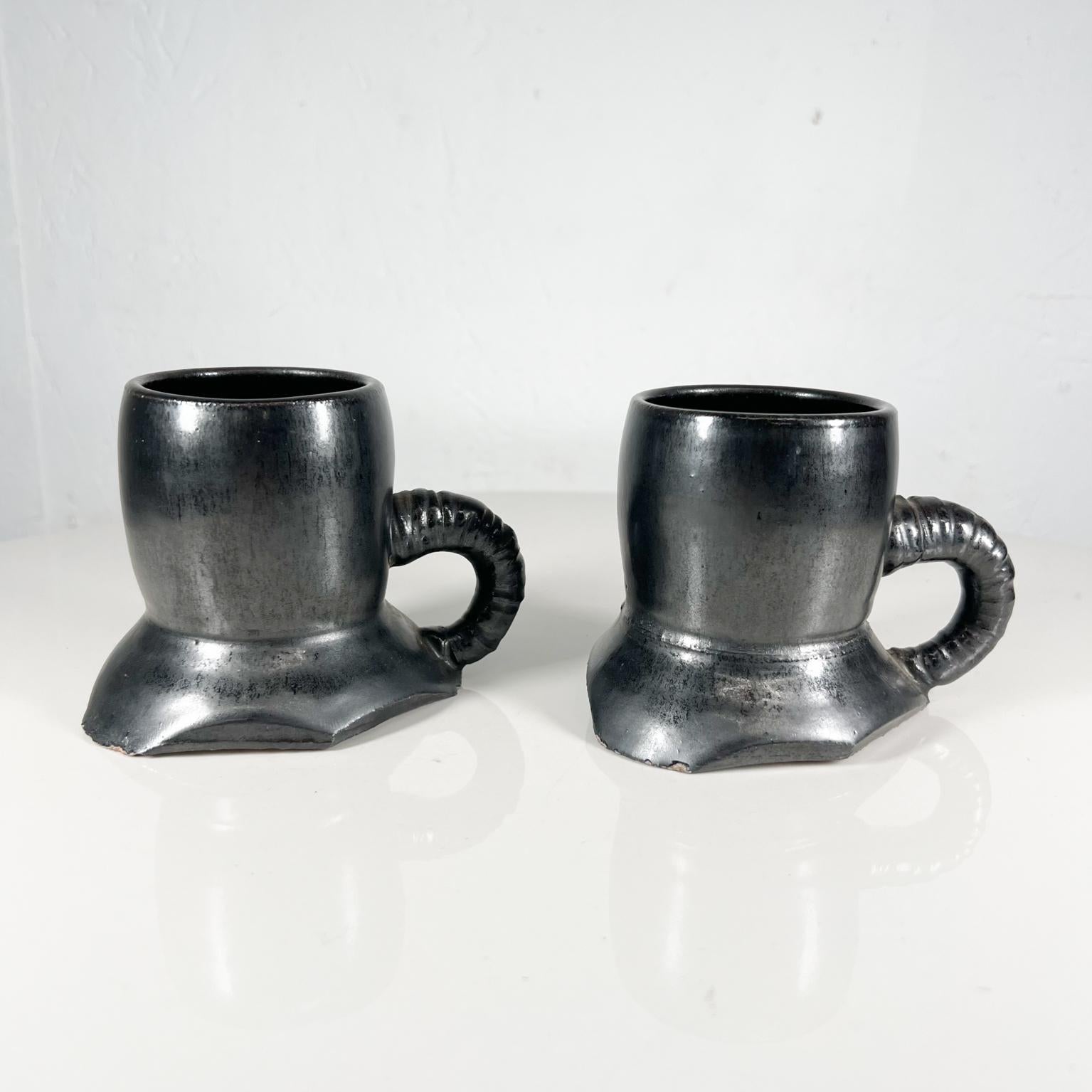 1980s black mugs sculptural pottery art coffee cups signed Melching
Signed by artist 1983
Measures: 3.75 tall x 2.63 diameter 4.75 d x 3.63 w
Preowned unrestored vintage condition
See images provided.
  