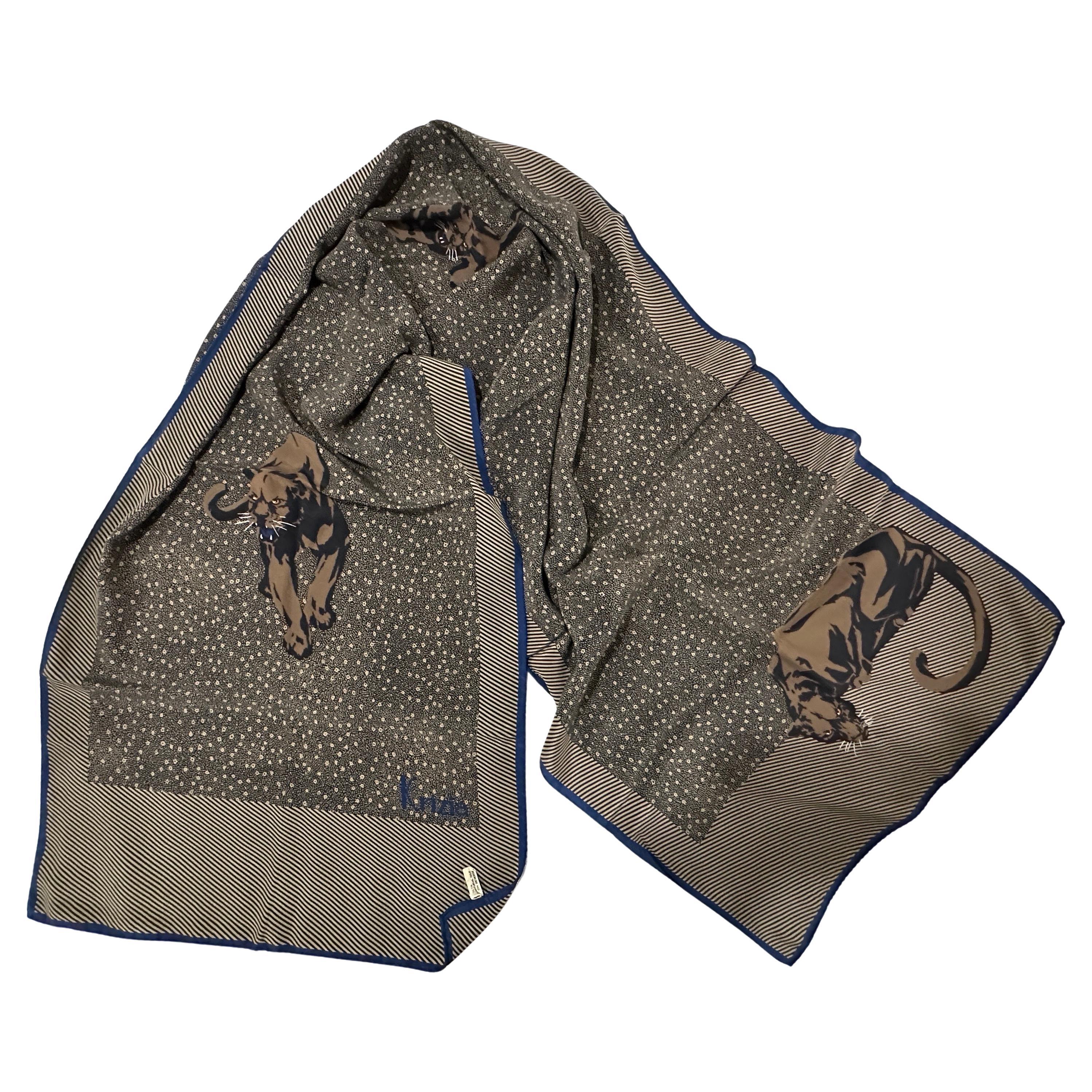 Iconic Vintage 1980s Krizia Silk Scarf with Black Panther Print
This vintage silk scarf by the renowned Italian fashion house, Krizia is a true collector's item, celebrating the brand's distinctive and often animal-inspired aesthetic.
The scarf is