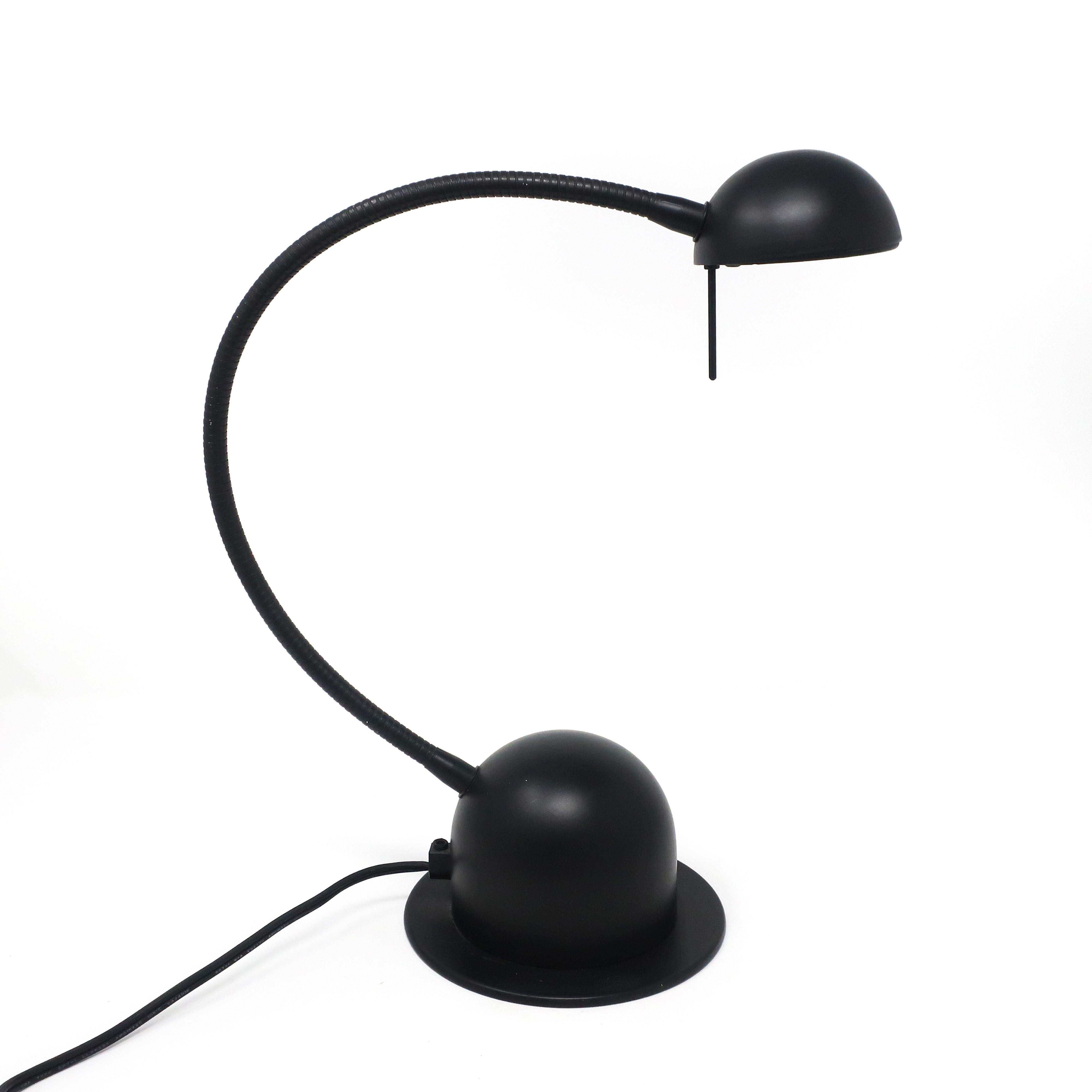 A Minimalist 1980s postmodern Veneta Lumi desk lamp with spherical black base and shade and black gooseneck. Switch is on the cord. In excellent vintage condition.

Measures: 6” x 6” x 13”, extends to 21”.