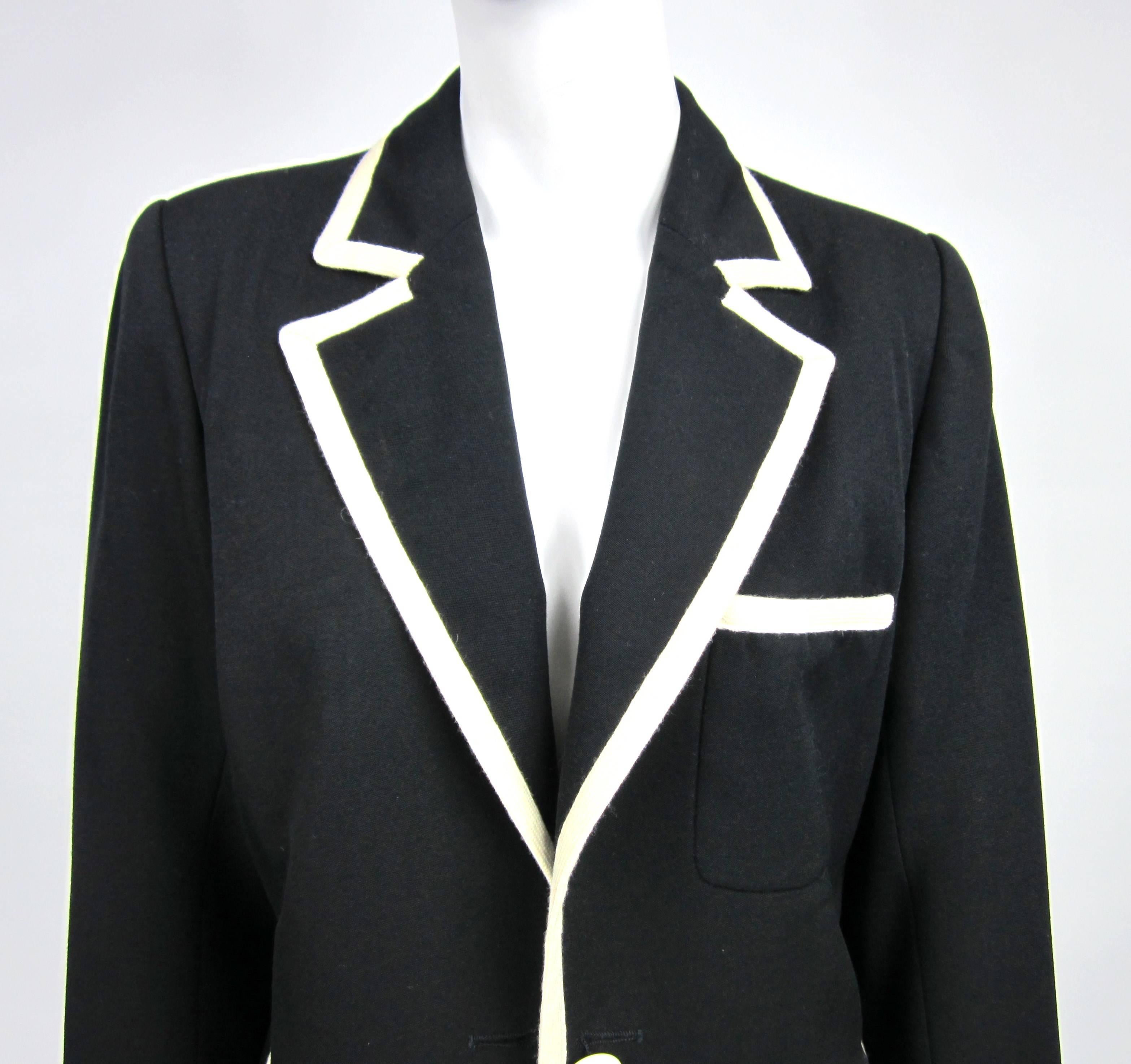 Clean lines on this Yves Saint Laurent Jacket. Classic look with the Black & white trim. Measuring. Up to 40in on the bust. Up to 36in on the waist. Sleeve 22.5in  -- 21.5 in. Long.  Listing it as good condition, but it is better than good. Have to