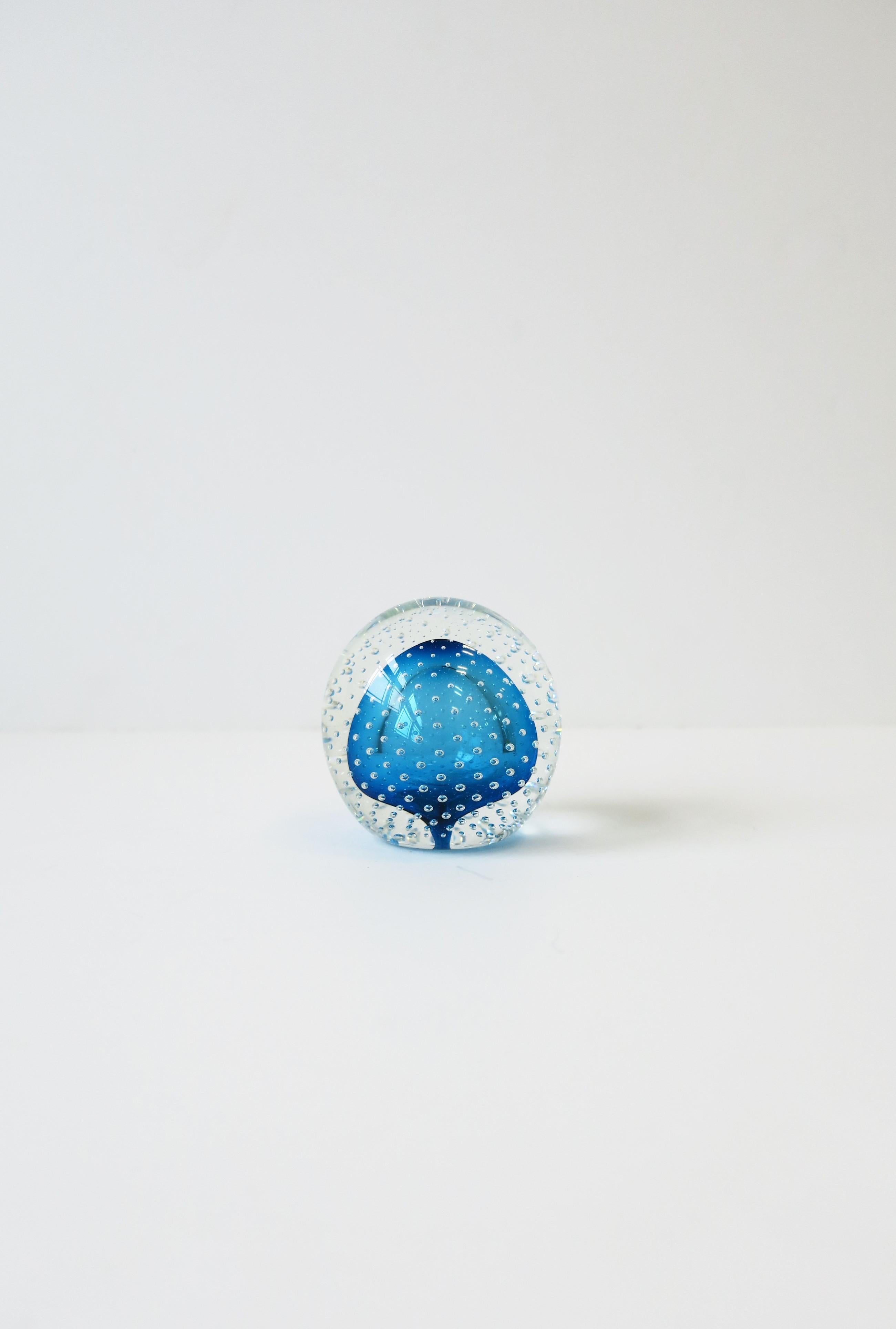 A very beautiful blue and clear art glass decorative object or paperweight with a 'controlled bubble' design, circa 1980s. Signed and dated by artist on bottom: Mark Matthew '1986'. 

Measures: 3.38