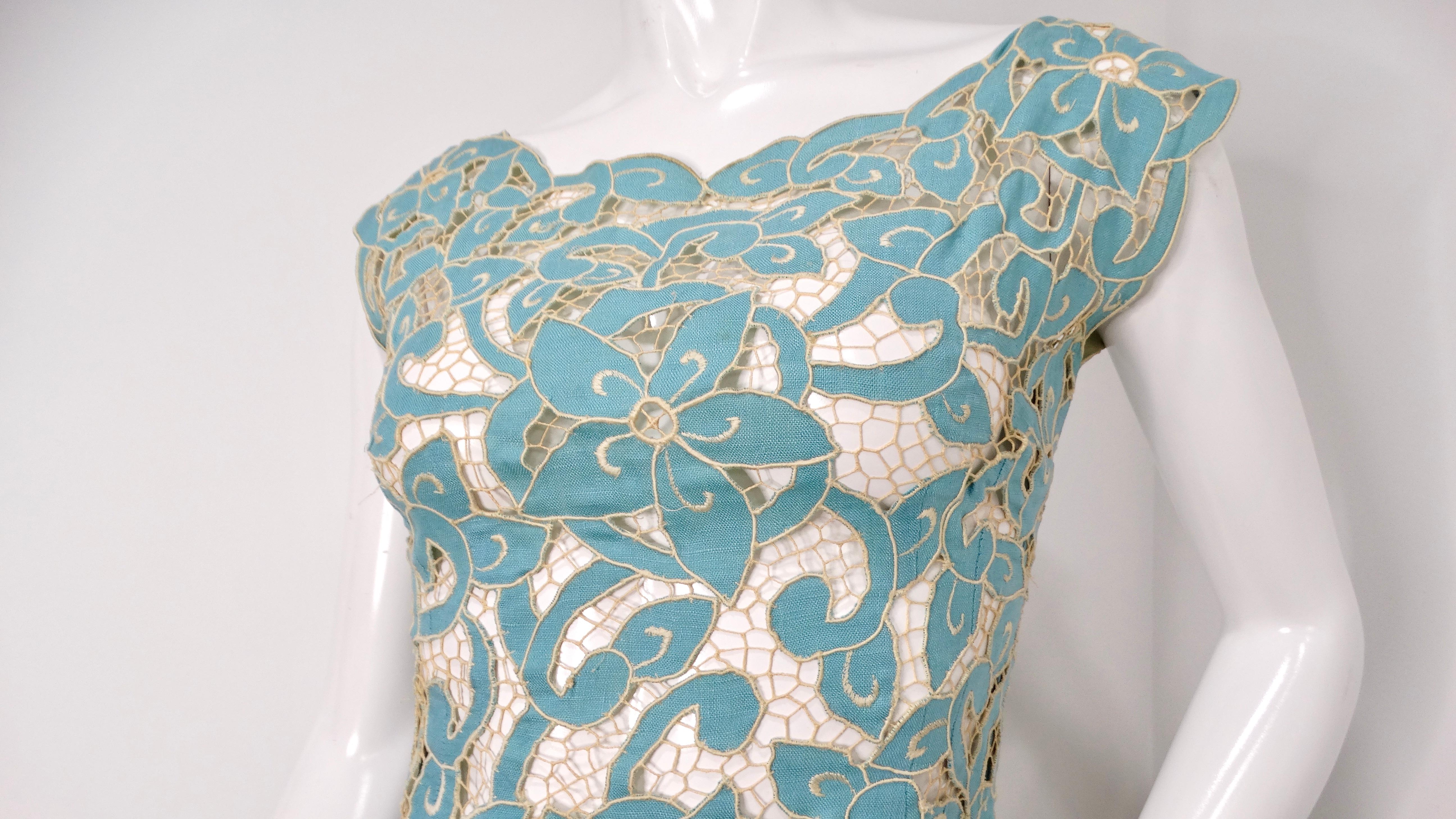 Step back in time with this exquisite 1980s Blue & Cream Floral Net Detail Cut-Out Midi Dress, a stunning piece that encapsulates the bold and adventurous spirit of the era. Crafted in circa vintage 1980s, this dress features a captivating floral
